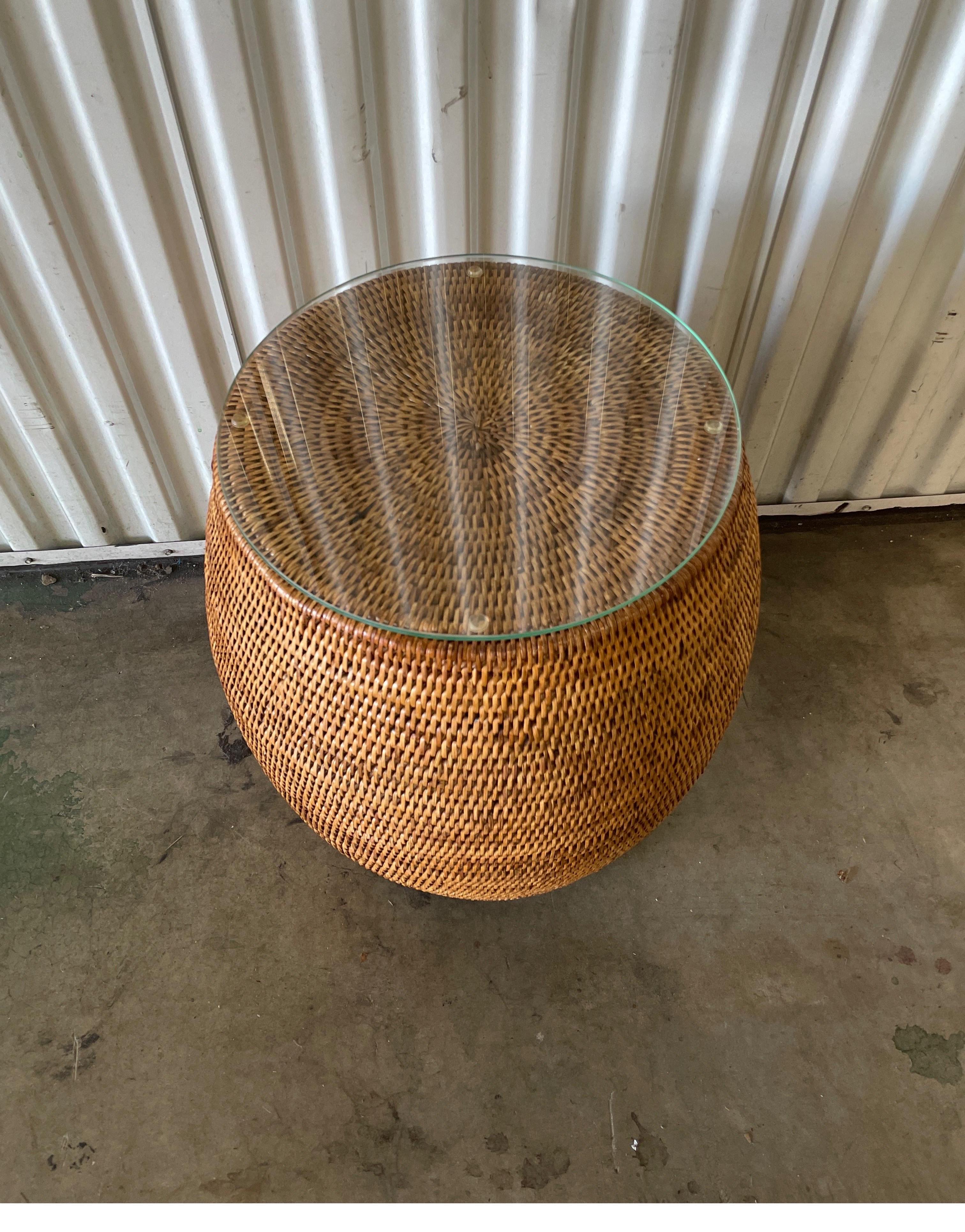 Natural woven bamboo garden stool side table with glass top. This lovely piece has a variety of uses. Makes a great drinks table.
