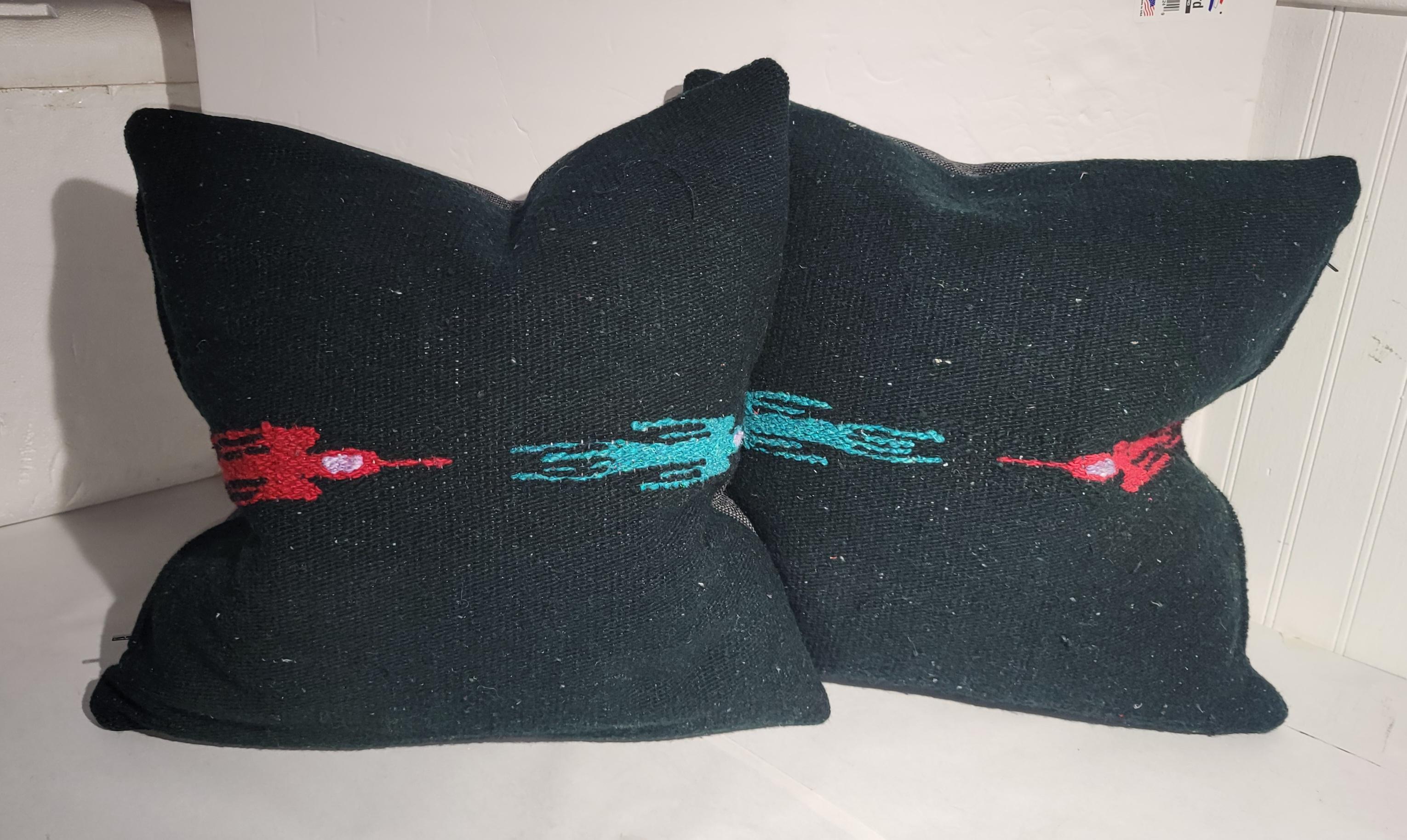 Pair of wool hand made birds in flight pillows. Black background with blue and red birds in flight. Vintage fabrics made into pillows