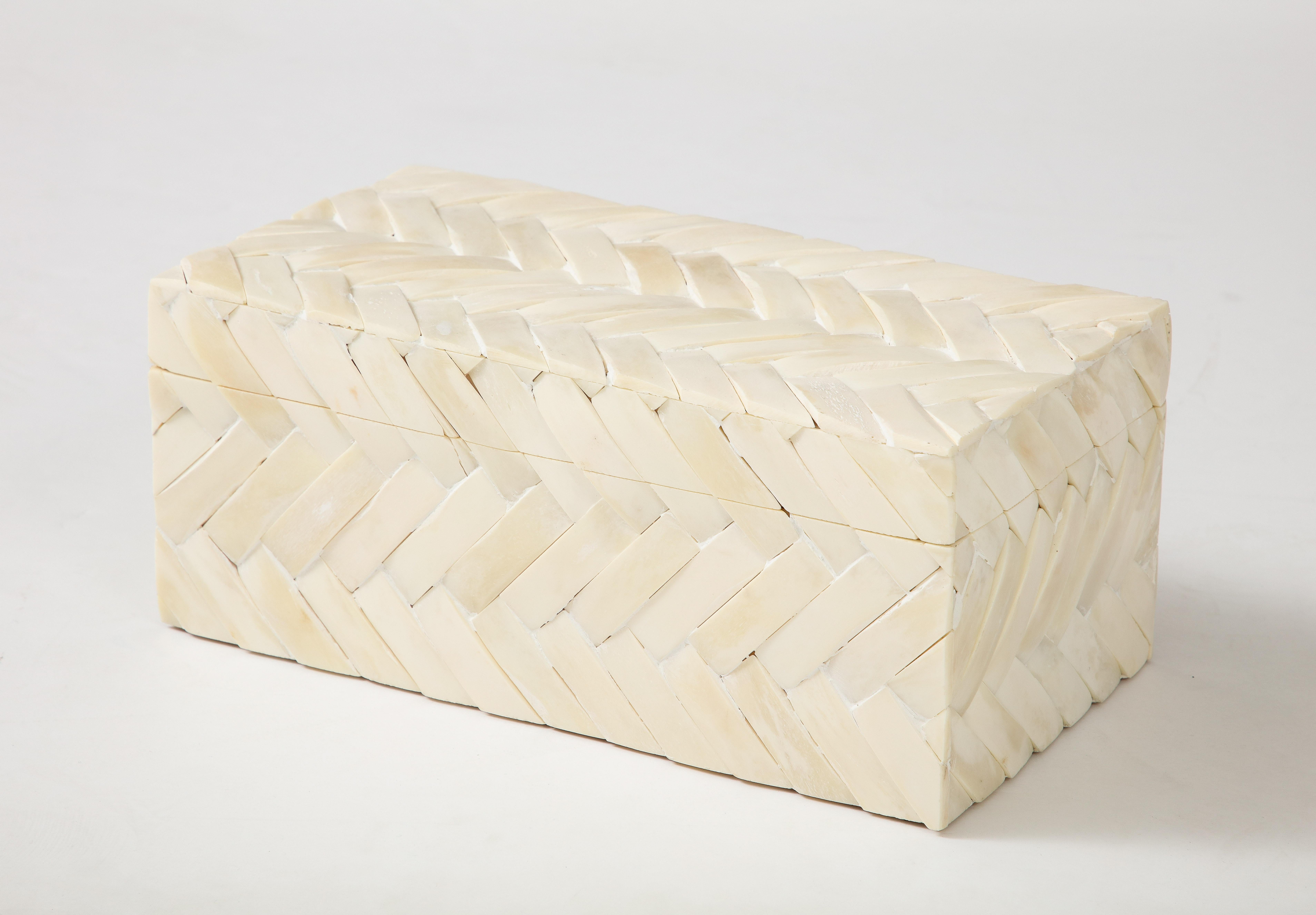 Contemporary document, keepsake box featuring bone tiles in a cheveron pattern over a wood structure. A great solution for remote control storage, or as a desk accessory.