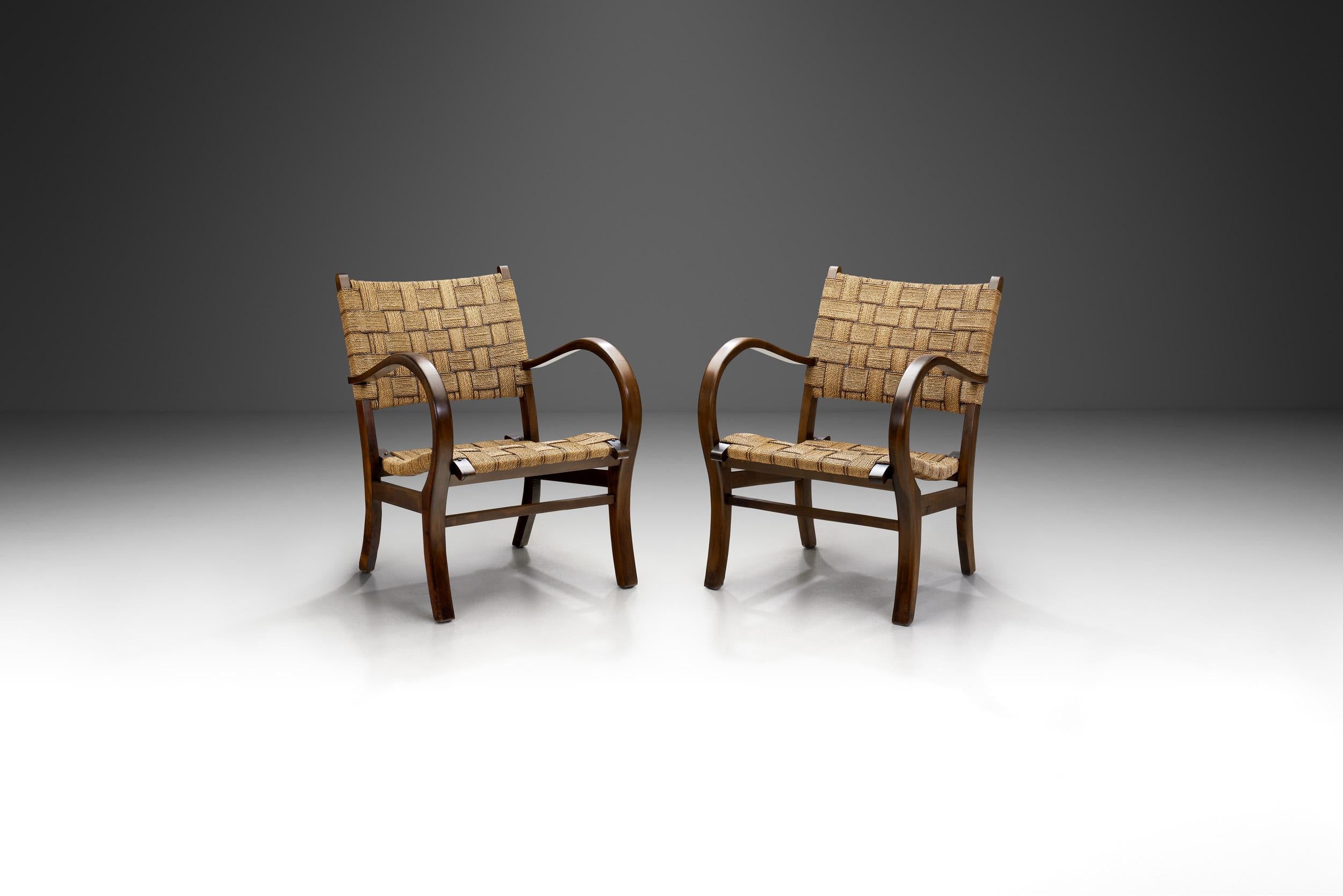 Erich Dieckmann was one of the pre-eminent furniture designers of the Bauhaus and, like Marcel Breuer, was experimenting with steel tubing, standardization, and geometric forms in the 1920s and 1930s. 

This rare pair of armchairs, recalling the