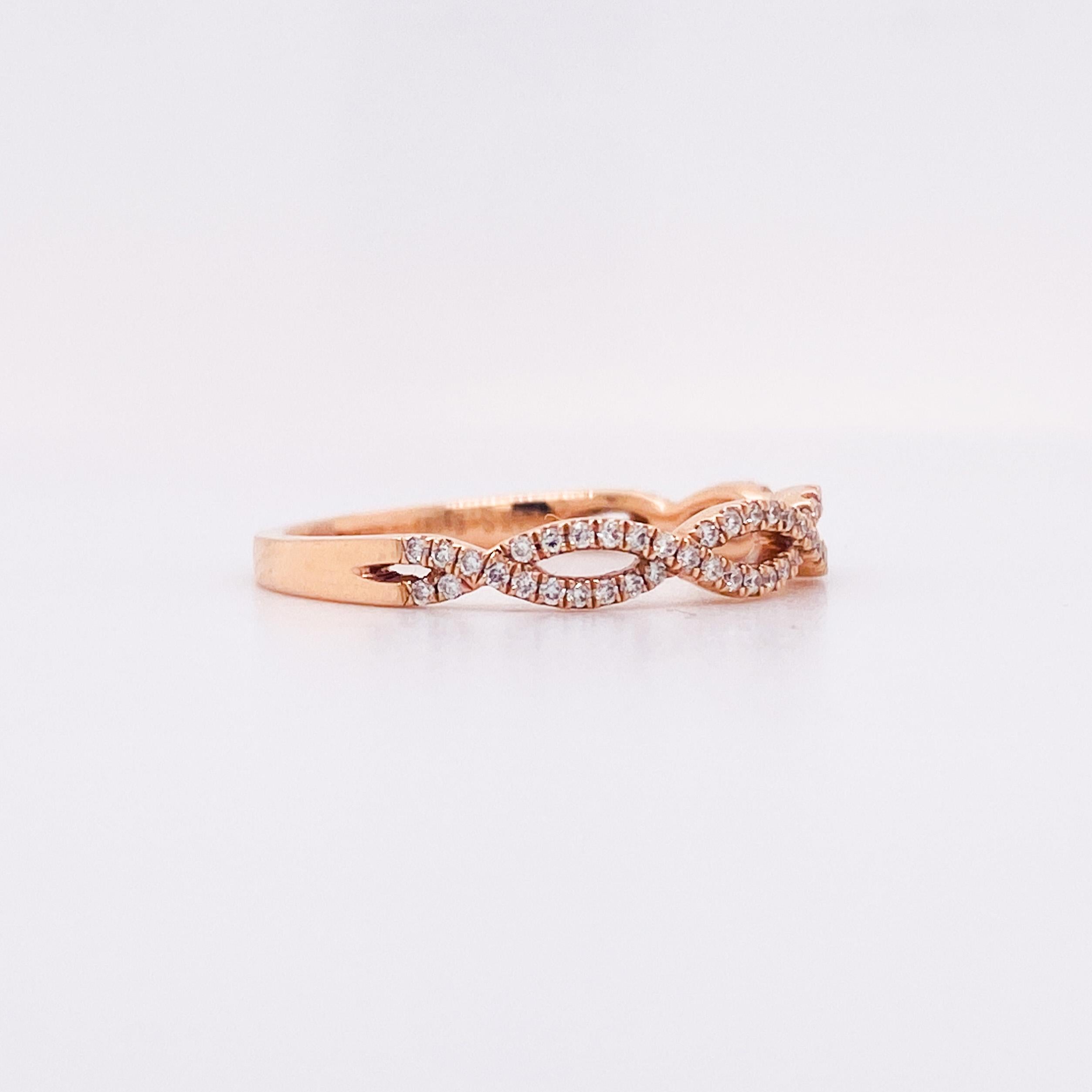 Like two ribbons, this ring has a gorgeous twisted woven braided design. Its pave diamond criss-cross design covers the top half of your finger. It makes for the perfect stand-alone or stackable band. The ring we have here in our store is made in 14