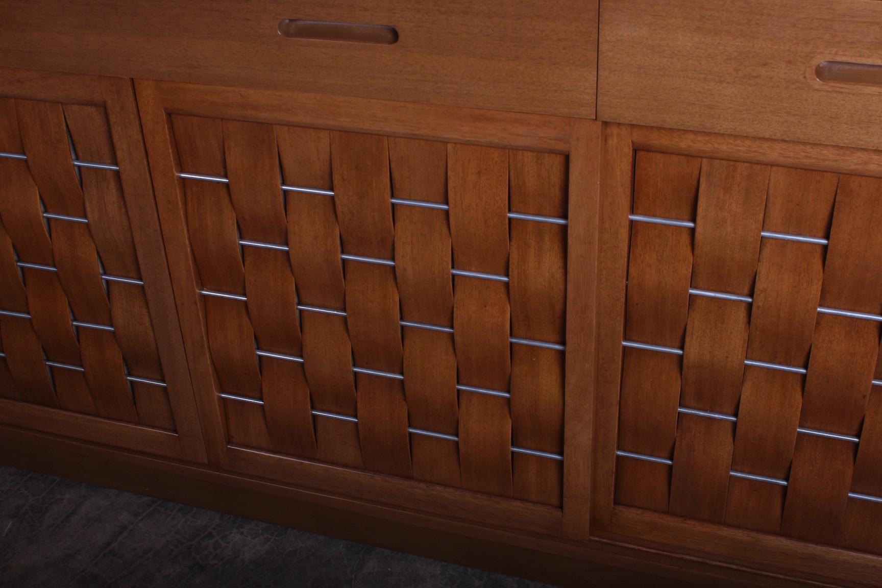 A bleached mahogany woven front credenza designed by Edward Wormley for Dunbar.