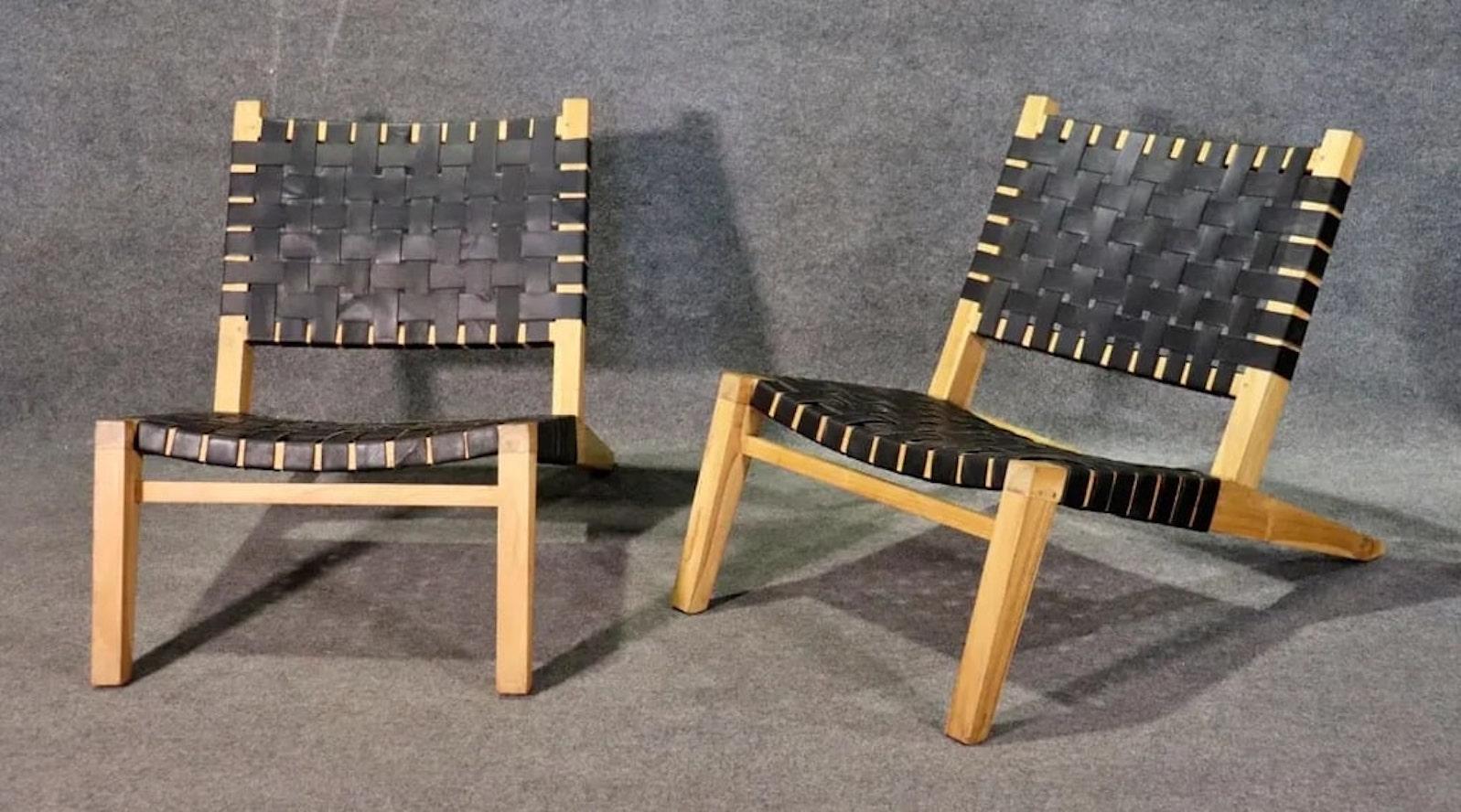 Pair of modern low lounge chairs with woven rubber straps over blonde wood frames. Great mid-century style with low profile.
Please confirm location NY or NJ