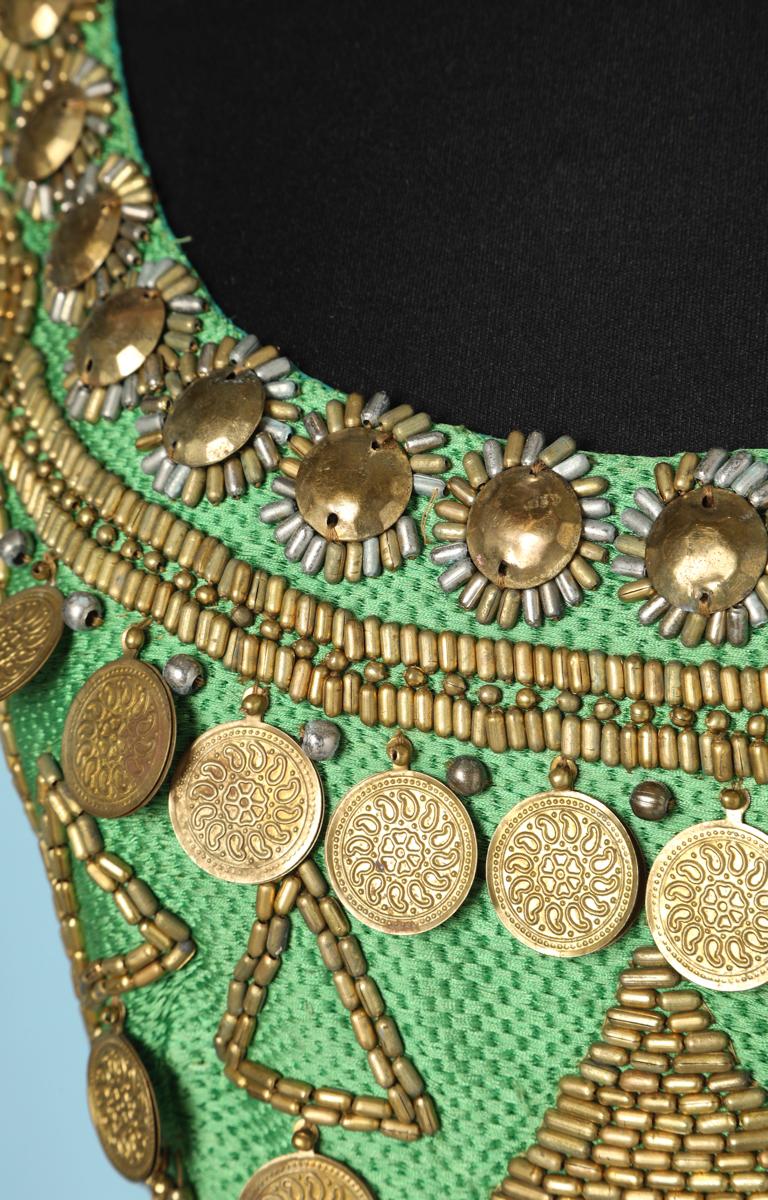 Green woven silk top with short sleeves, embroidered with pearls and gold pieces aztec style, Gianni Versace Couture
Back width 40cm