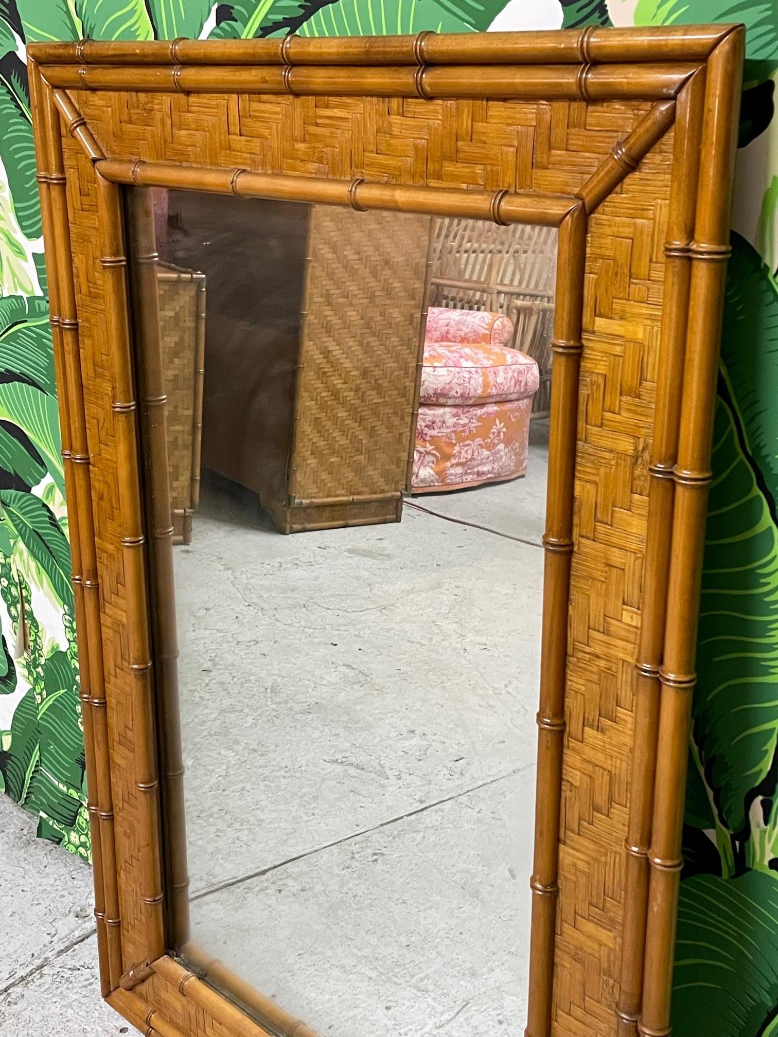 Mid-century wall mirror features a veneer of parquetry in a herringbone pattern and faux bamboo detailing. Good condition with only very minor imperfections consistent with age.

      