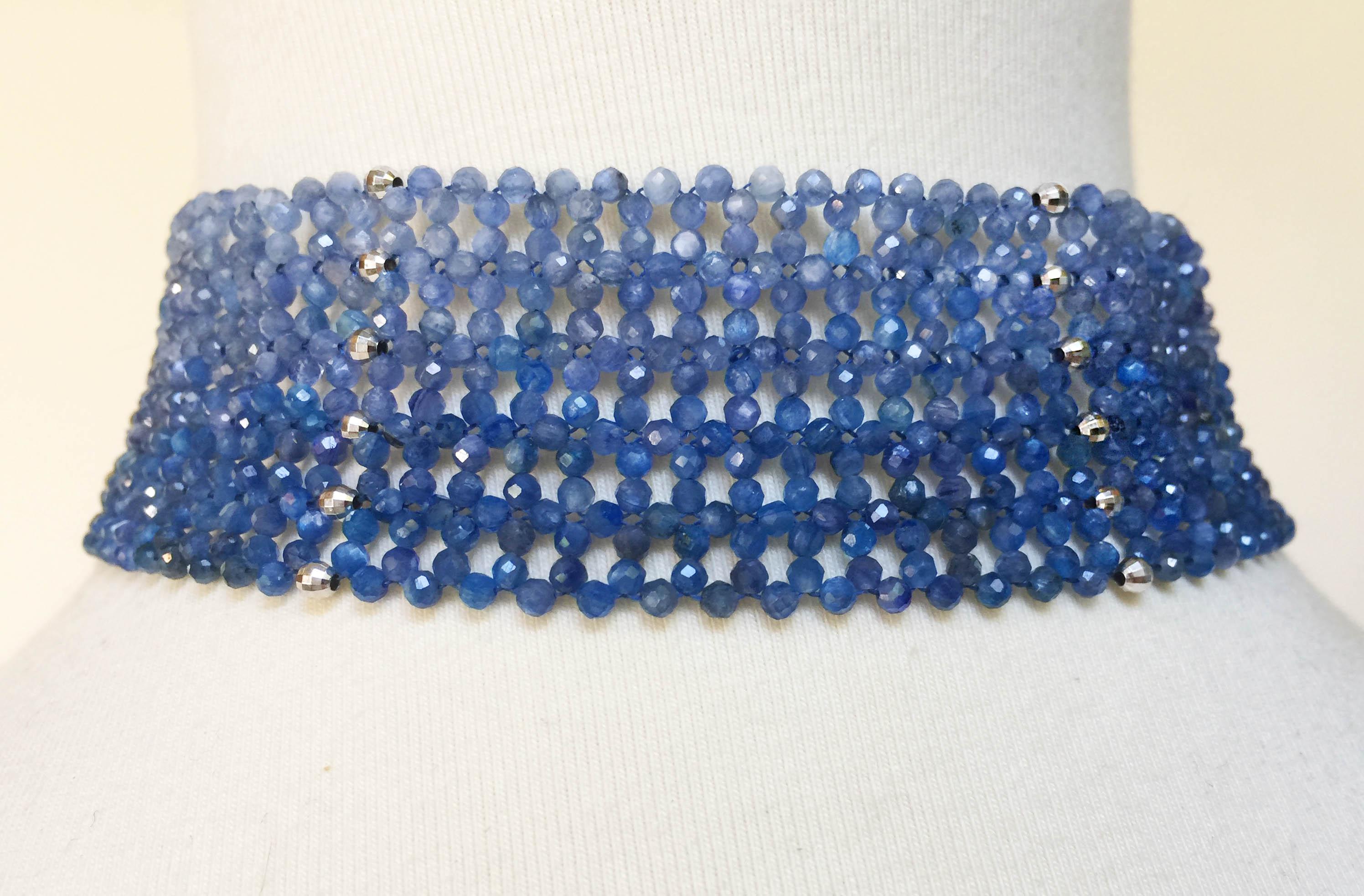 This woven kyanite beaded choker has a sterling silver (rhodium plated) sliding clasp highlighted with faceted sterling silver (rhodium plated) beads. The blue kyanite beads are woven with an ombre effect from an elegant light blue to a deep royal