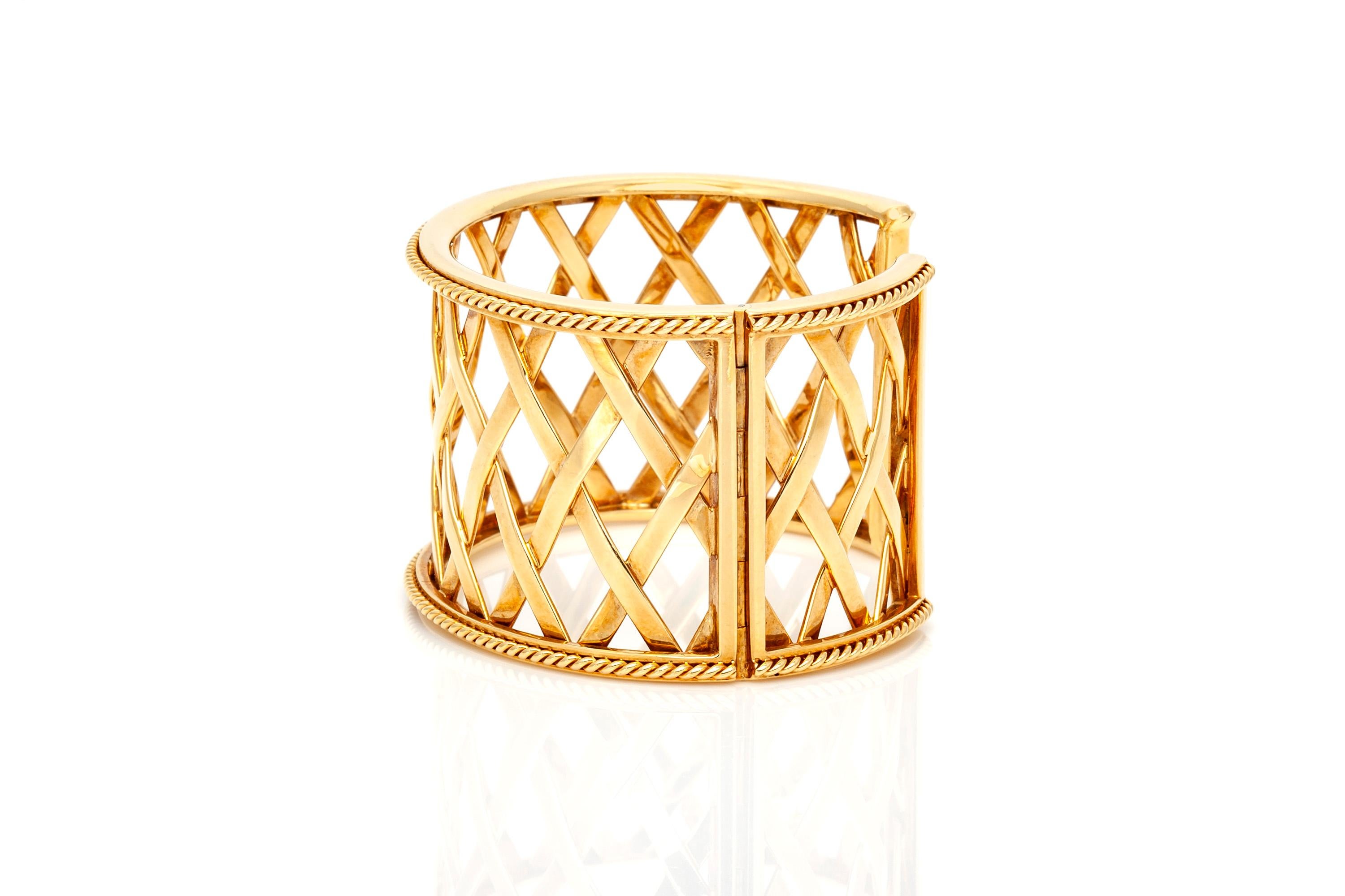 Signed by Christina Addison, 18k yellow gold Woven cuff with twisted rope border and hinged opening.