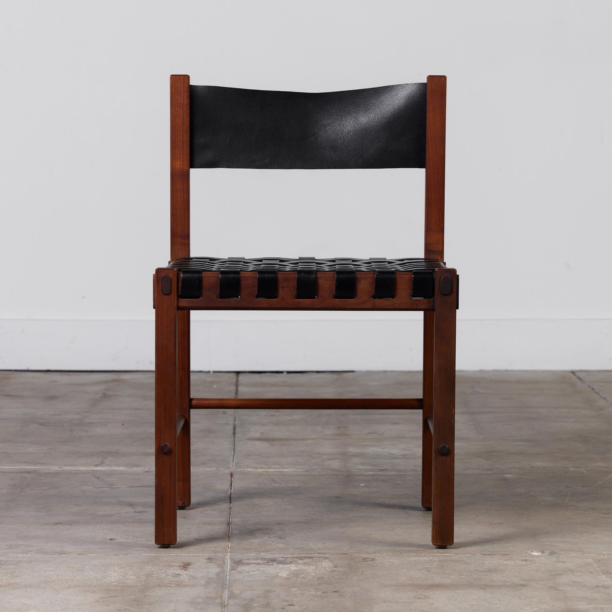 An eye catching design by Robert Baron for Glenn of California, c.1960s. This rare chair features rich walnut frame with woven leather seat and black leather backrest.

Dimensions: 19