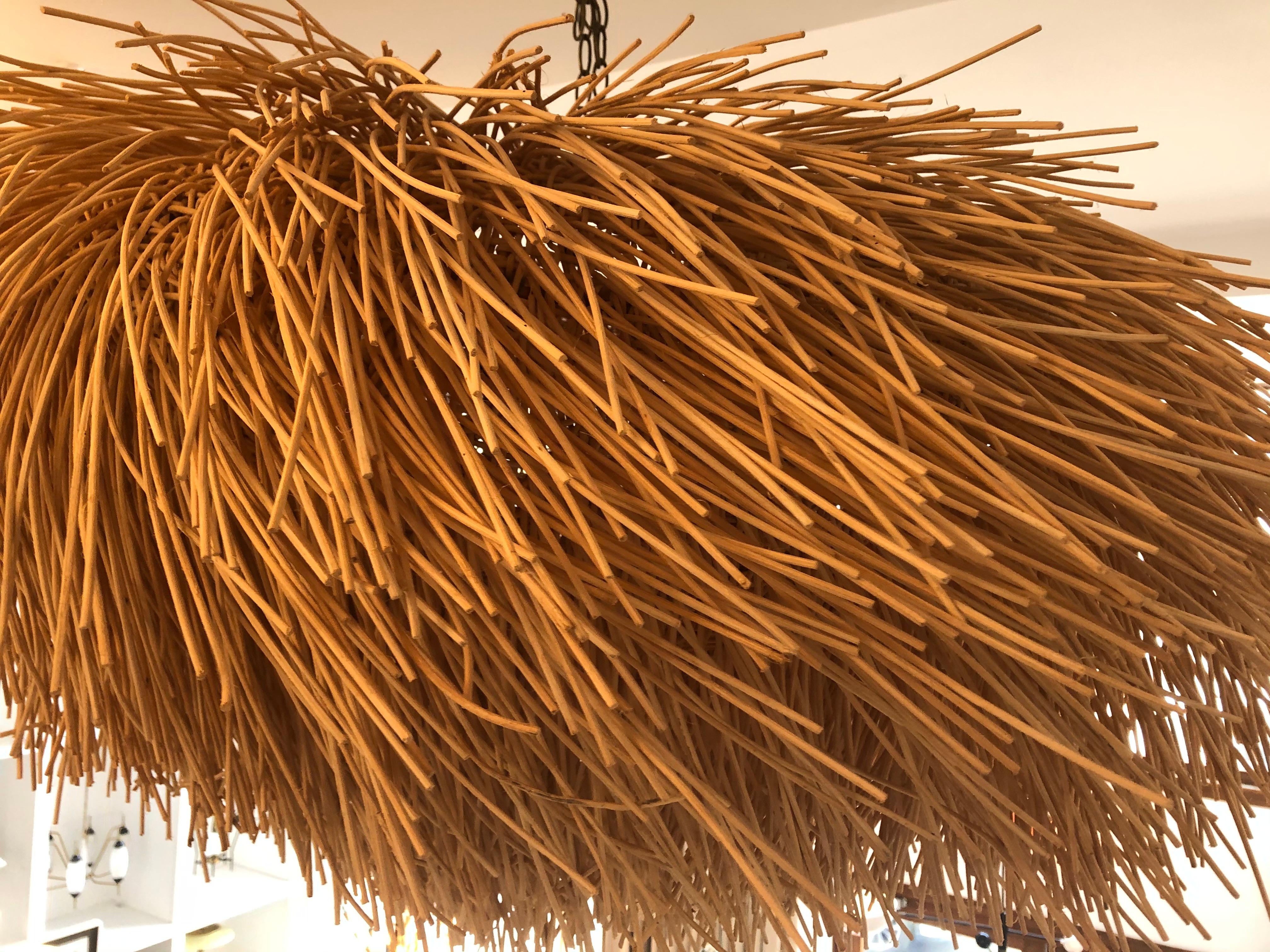 This whimsical raffia like material is actually a basket weaving natural wood similar to splining.  Because each piece is individually crafted allow some natural variation when ordering.  Available sizes: Small 30