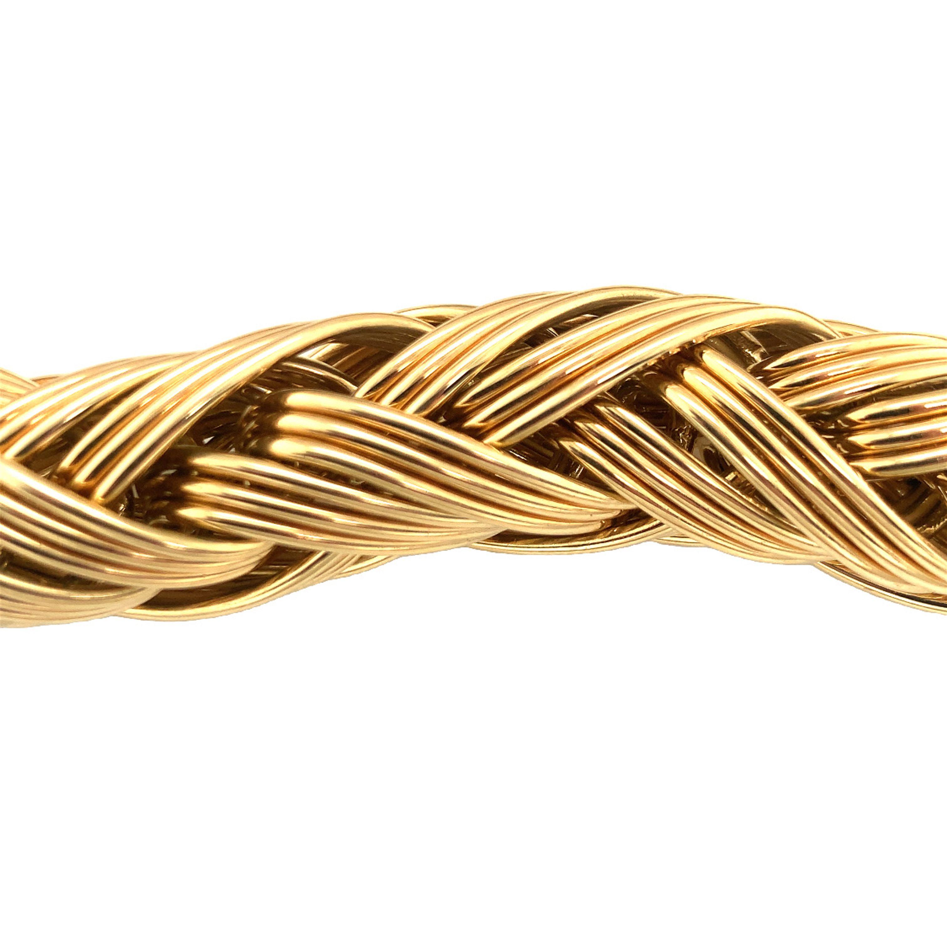 One woven, knotted link 18K yellow gold necklace with a tremendous tubular design measuring 17 millimeters wide. High polish, well built finish.

Immense, grand, imposing.

Metal: 18K yellow gold
Circa: 1960s
Stamp/Hallmark: Germany, 18Kt,