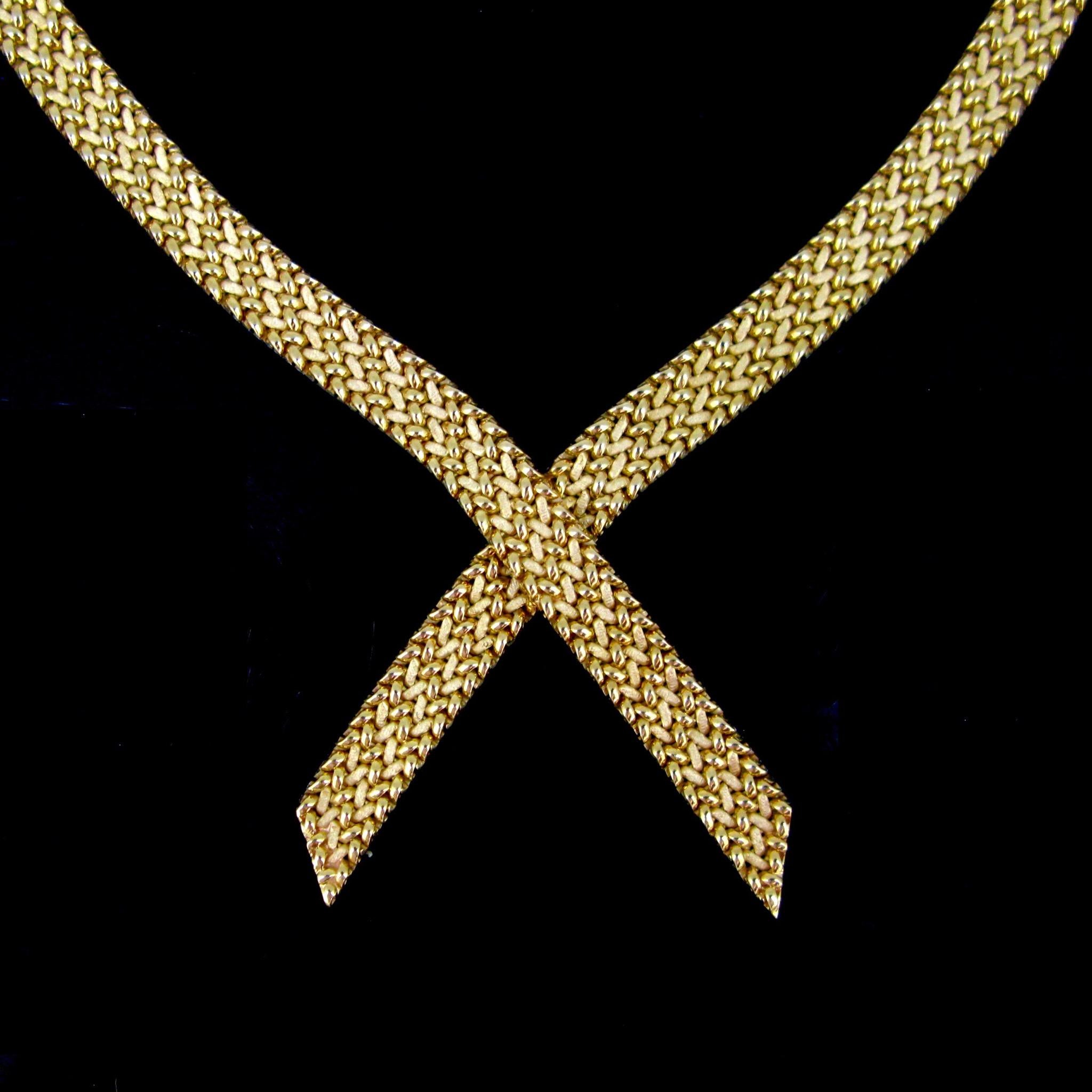 This ravishing collar necklace from the Seventies is fully made in 18k yellow woven gold. The necklace is very pleasant to wear It is marked with the French the eagle’s head for 18k gold and there is also the maker’s mark of the jeweller