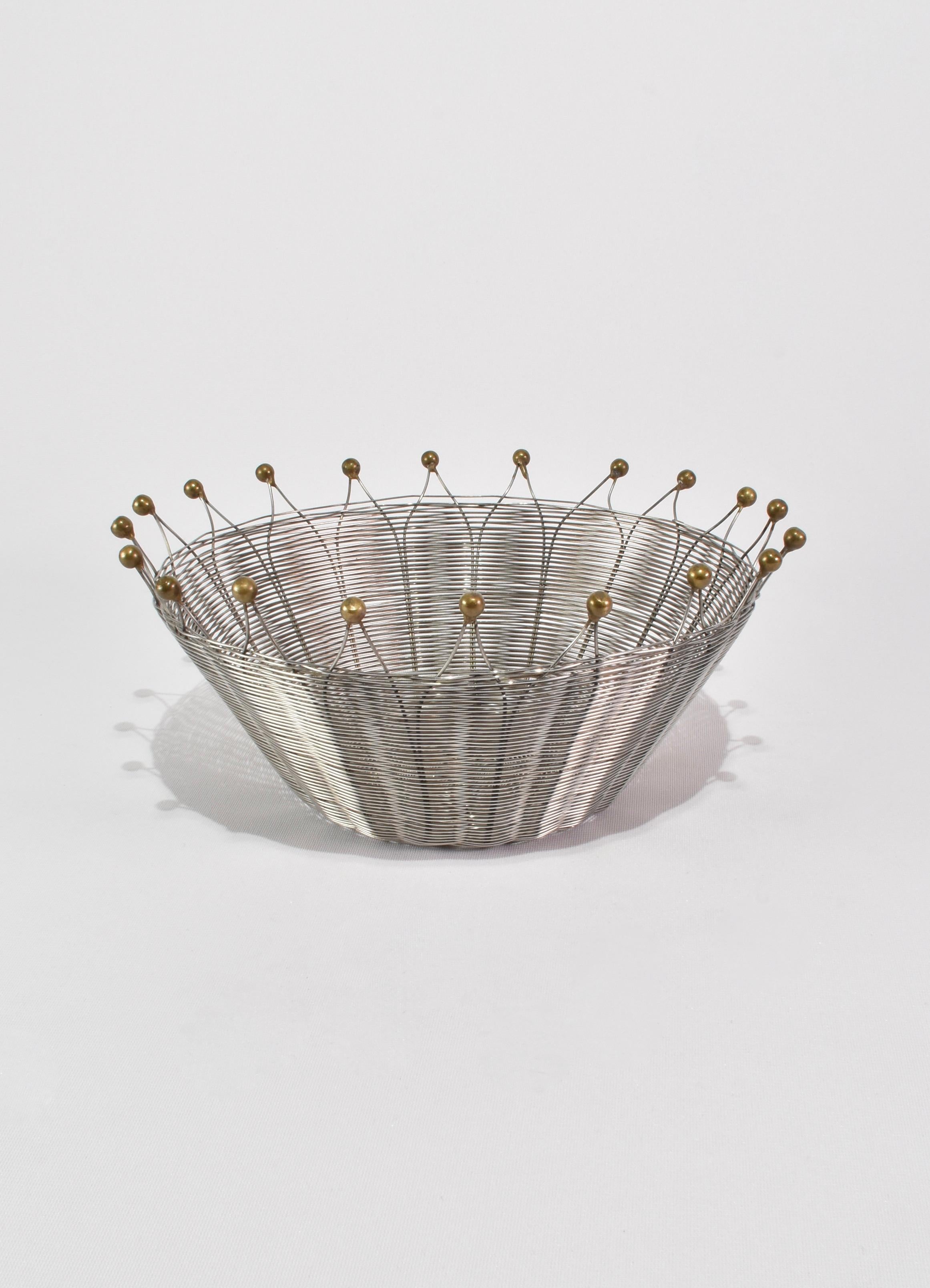 Stunning woven metal bowl with brass knob detail, attributed to Michael Aram. 