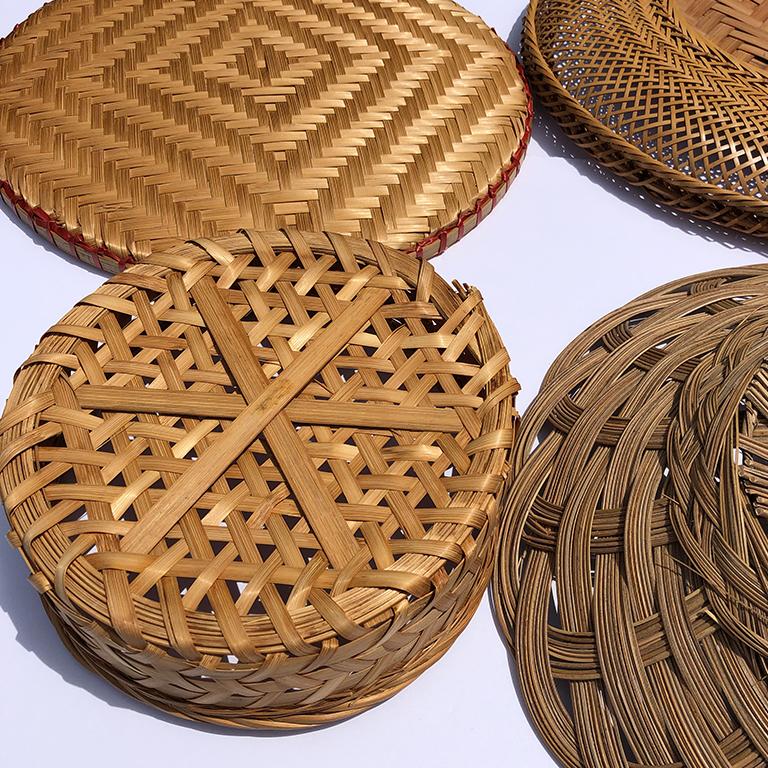 Set of 4 woven natural chinoiserie bamboo cane rattan baskets. Baskets are round in shape and each includes their own unique design. We love these paired together for a gallery wall or on a table for summer suppers. 

Each basket's dimensions are as