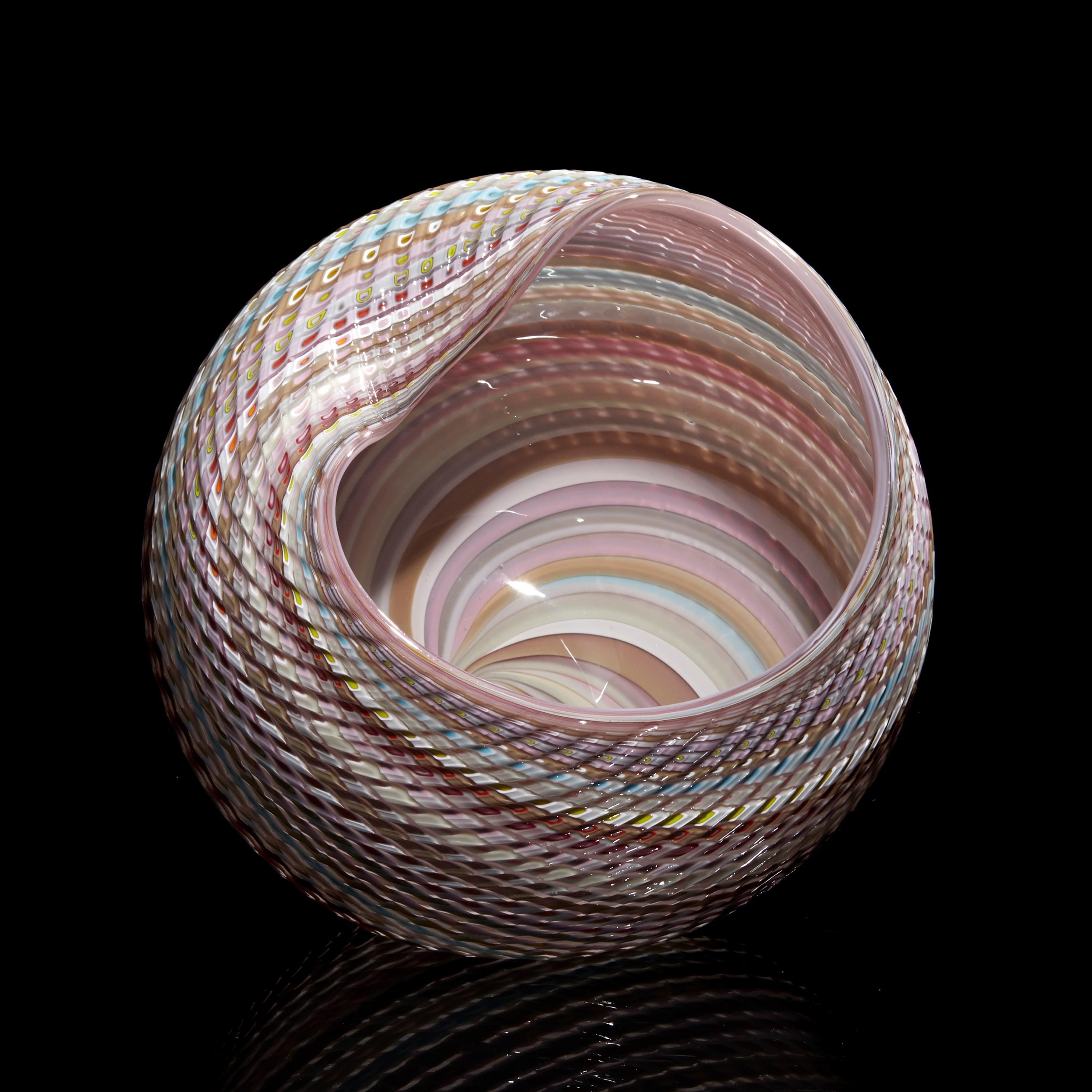 'Woven Pastel Mandala No 9 (shiny)' is a unique handblown, sculpted and cut glass sculpture by the British artist, Layne Rowe.

Rowe’s inspiration is drawn from the dramatic Devon coastline which informs his love for detail, a constant theme for