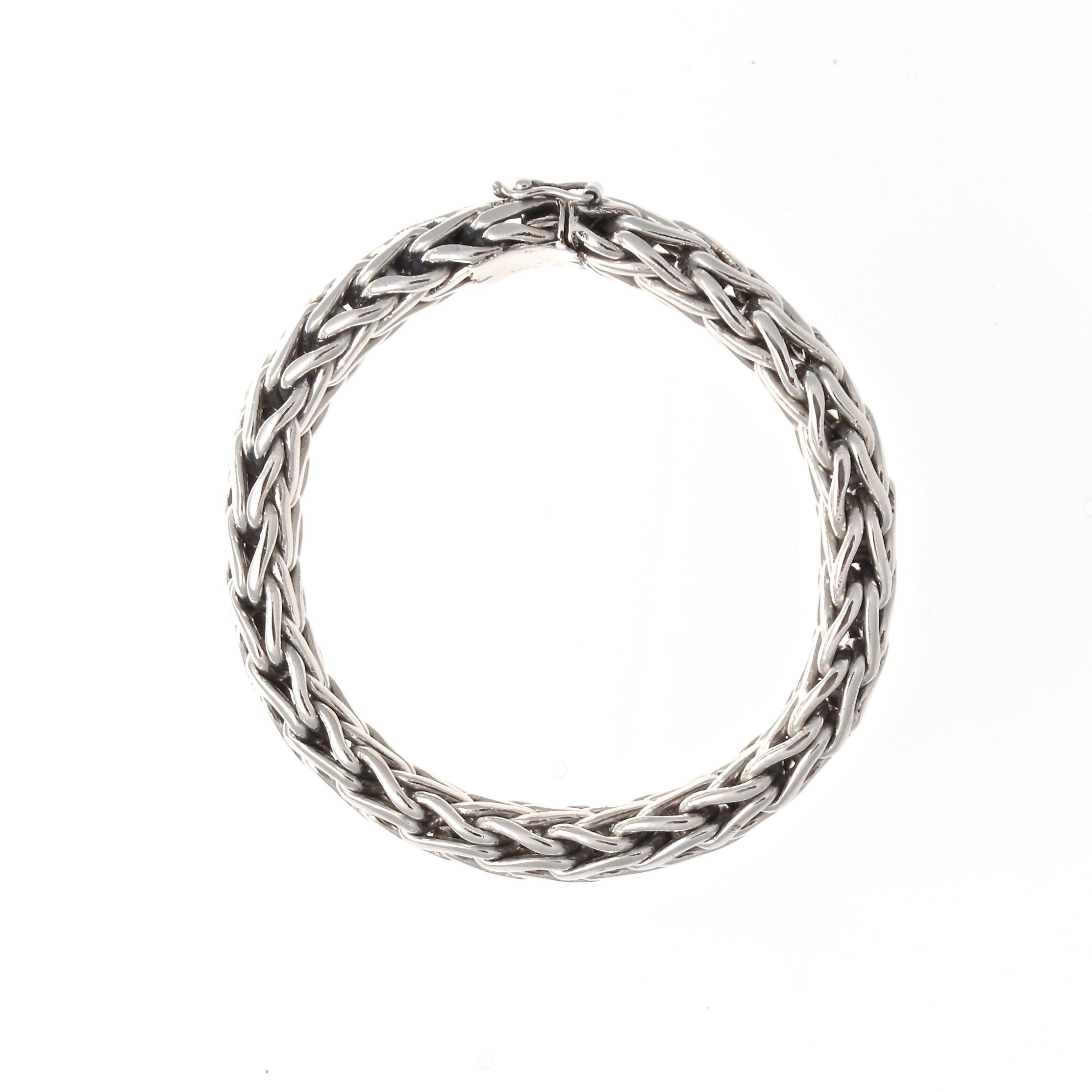 Simplicity is the essence of all true elegance. Designed in woven platinum. Weighs 150 grams.