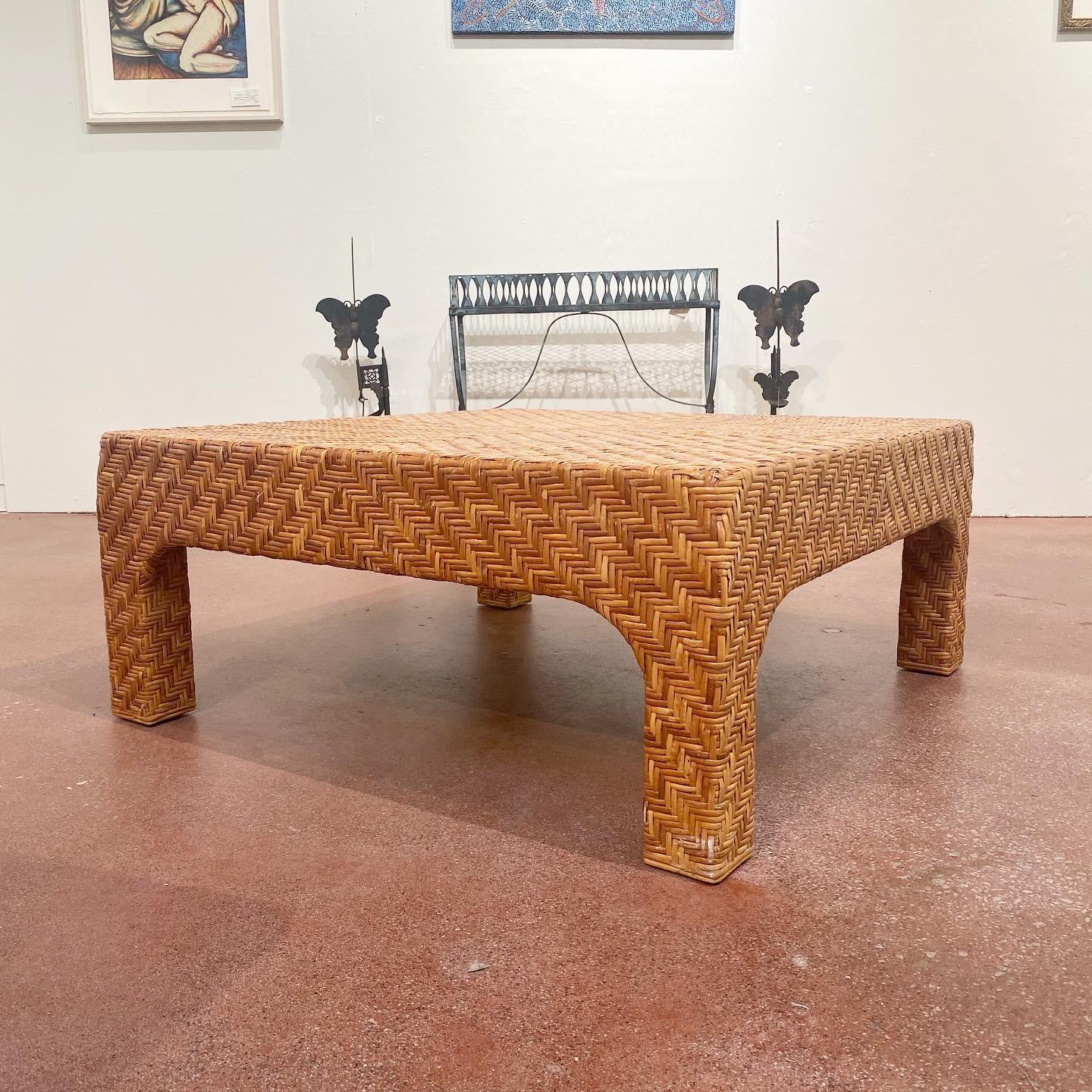 Vintage modern woven rattan coffee table. Completely enveloped in woven rattan and in excellent vintage condition.