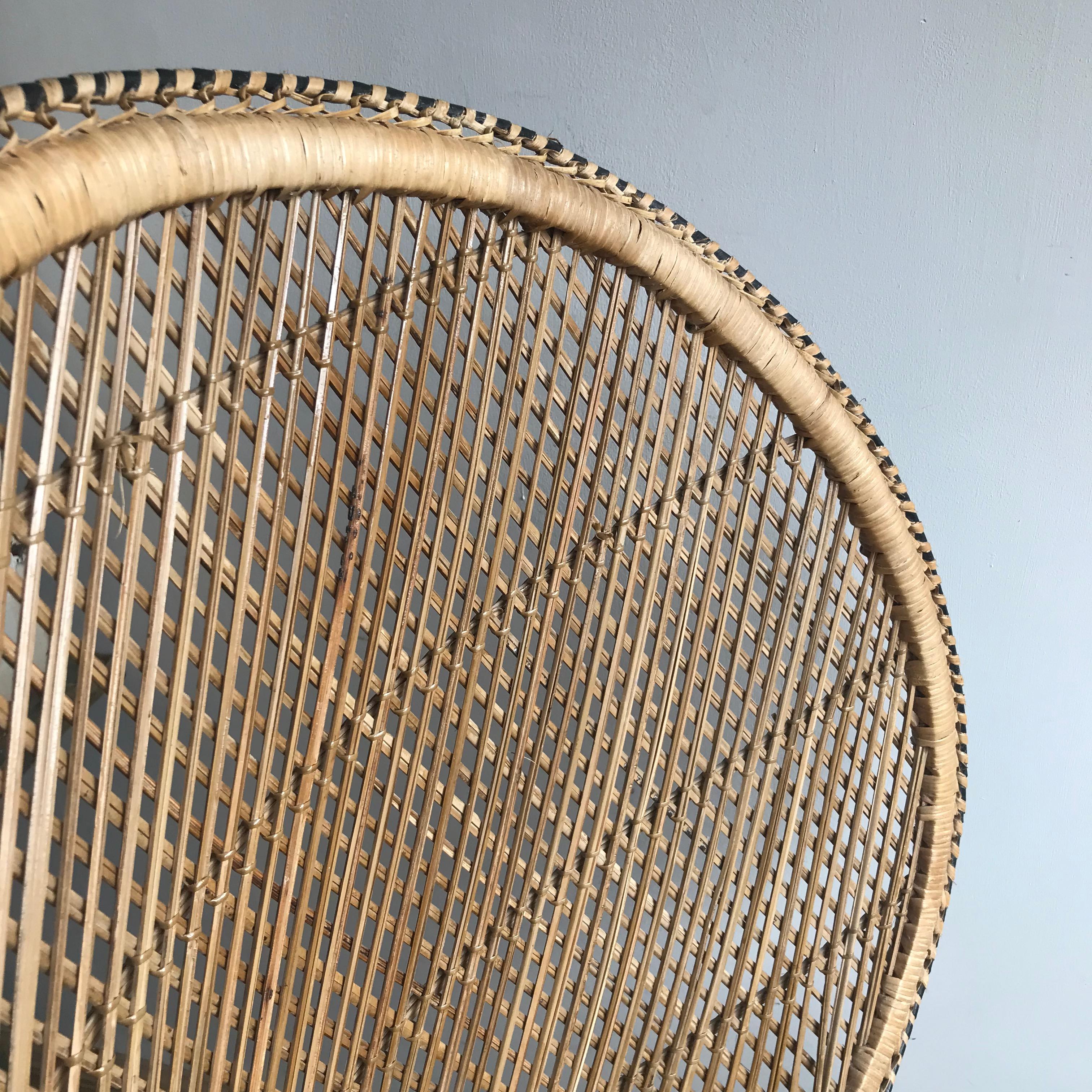 An original 1970s woven rattan peacock chair with a straight base and large fan back. The Emmanuel/peacock is constructed of intricate woven designs of bamboo and wicker. The chair is in very good vintage condition, the rattan has age-appropriate