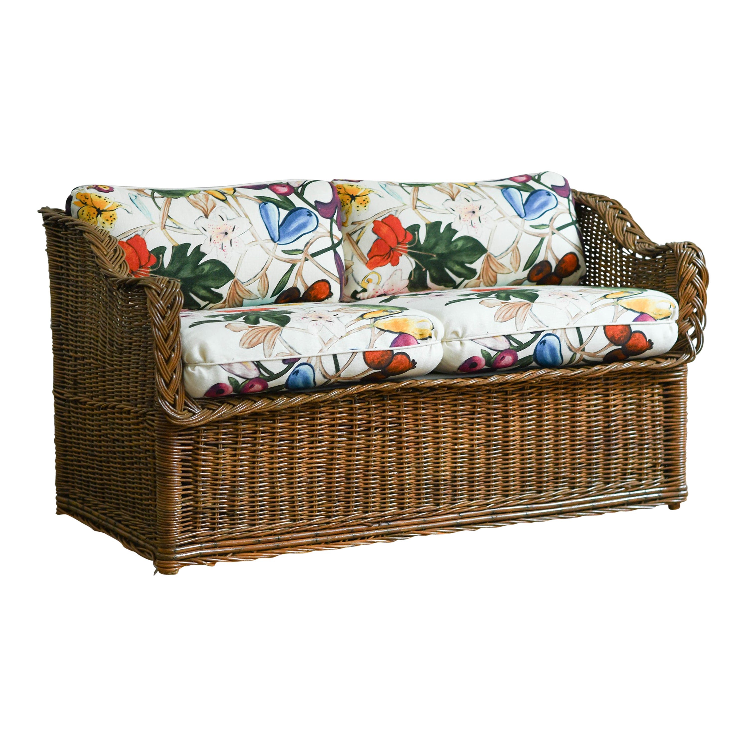 Woven rattan sofa with dedar fabric cushions