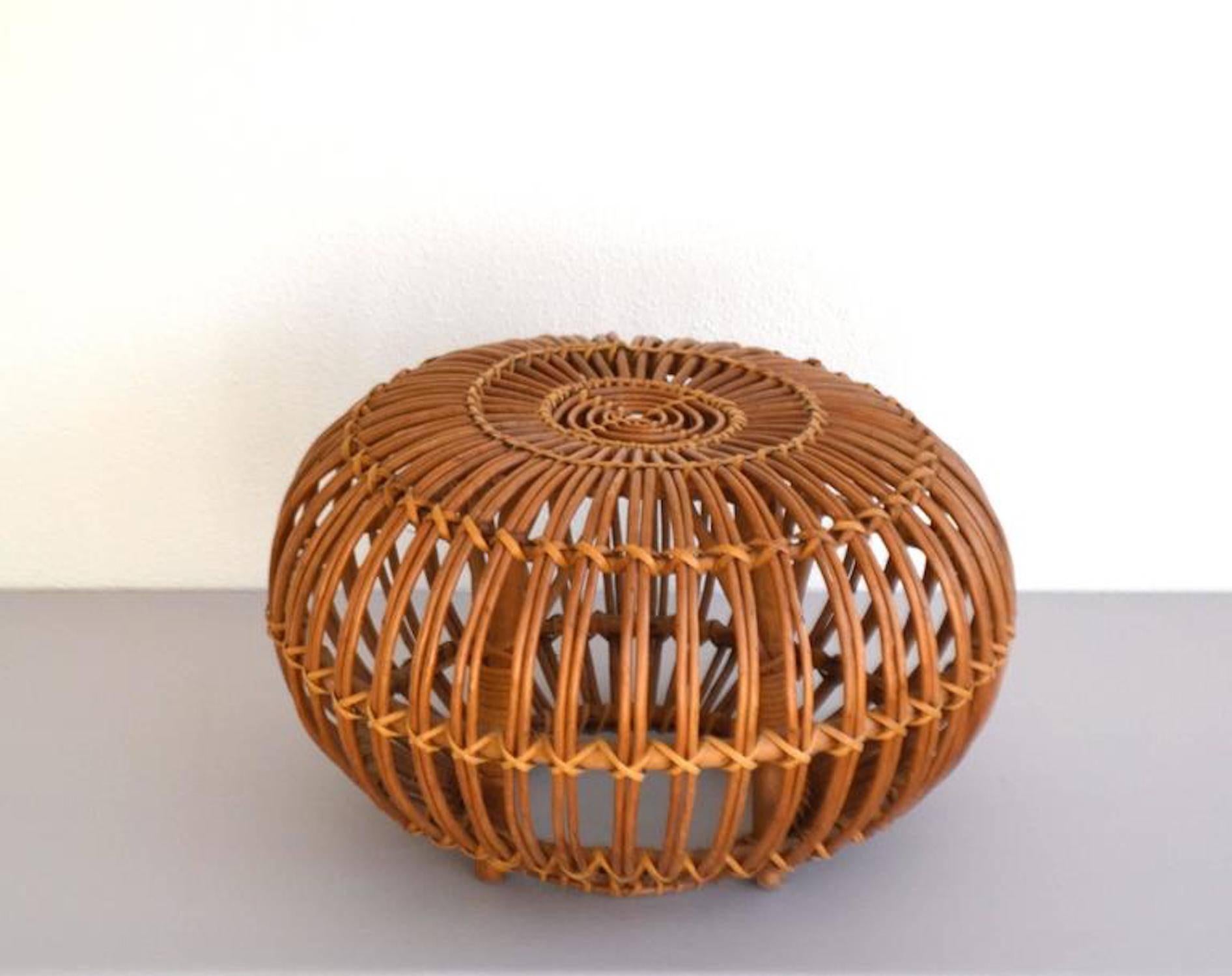 Striking Italian woven rattan stool, circa 1950s-1960s. This iconic midcentury ottoman or occasional table is in original excellent condition with a wonderful aged patina.
