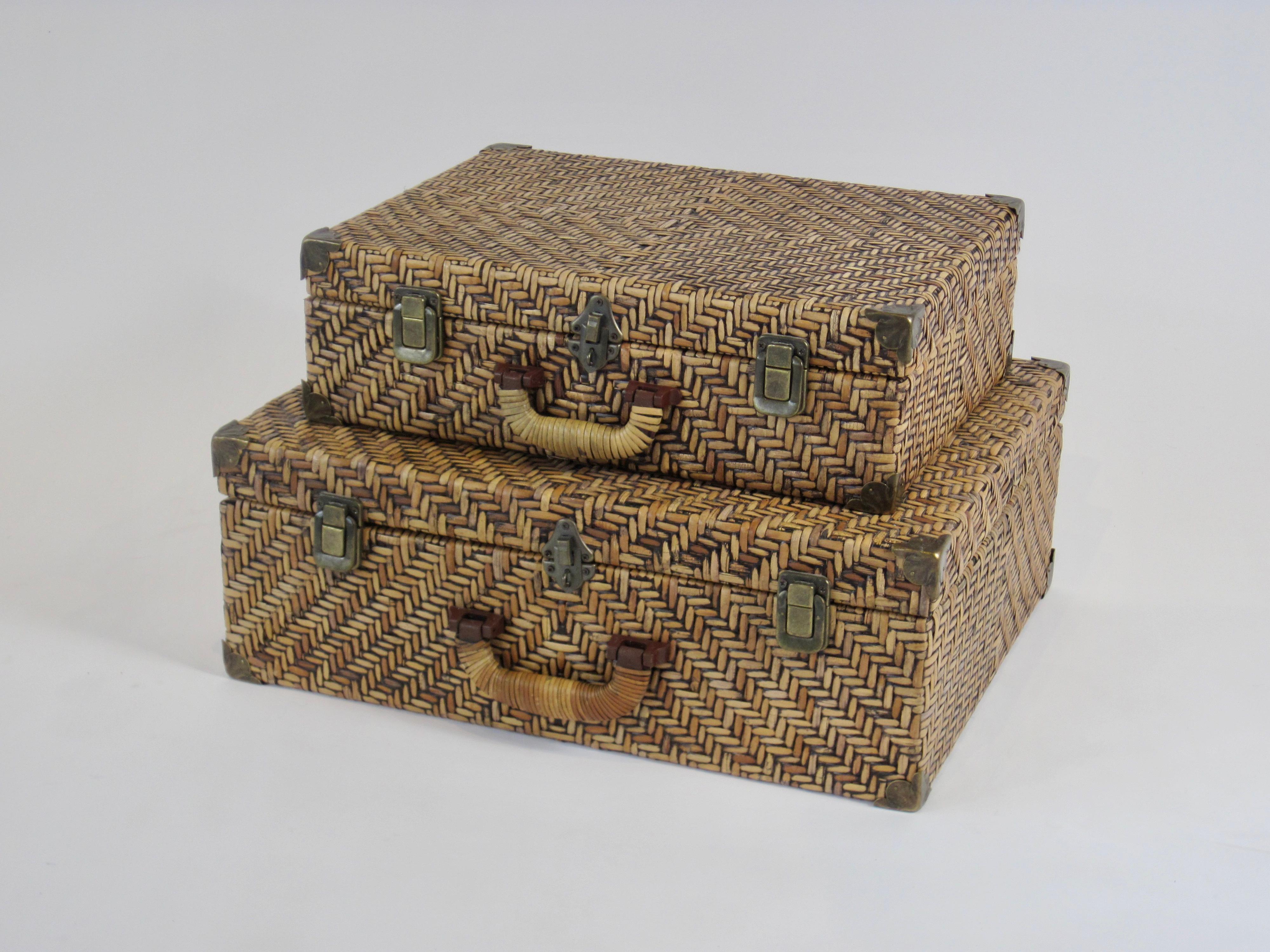 1970s pair of woven rattan luggage pieces with brass details and black stained wood interiors. Natural material vintage decor pieces to create  a layered look in any room.
Smaller luggage piece 12 x 16 x 5