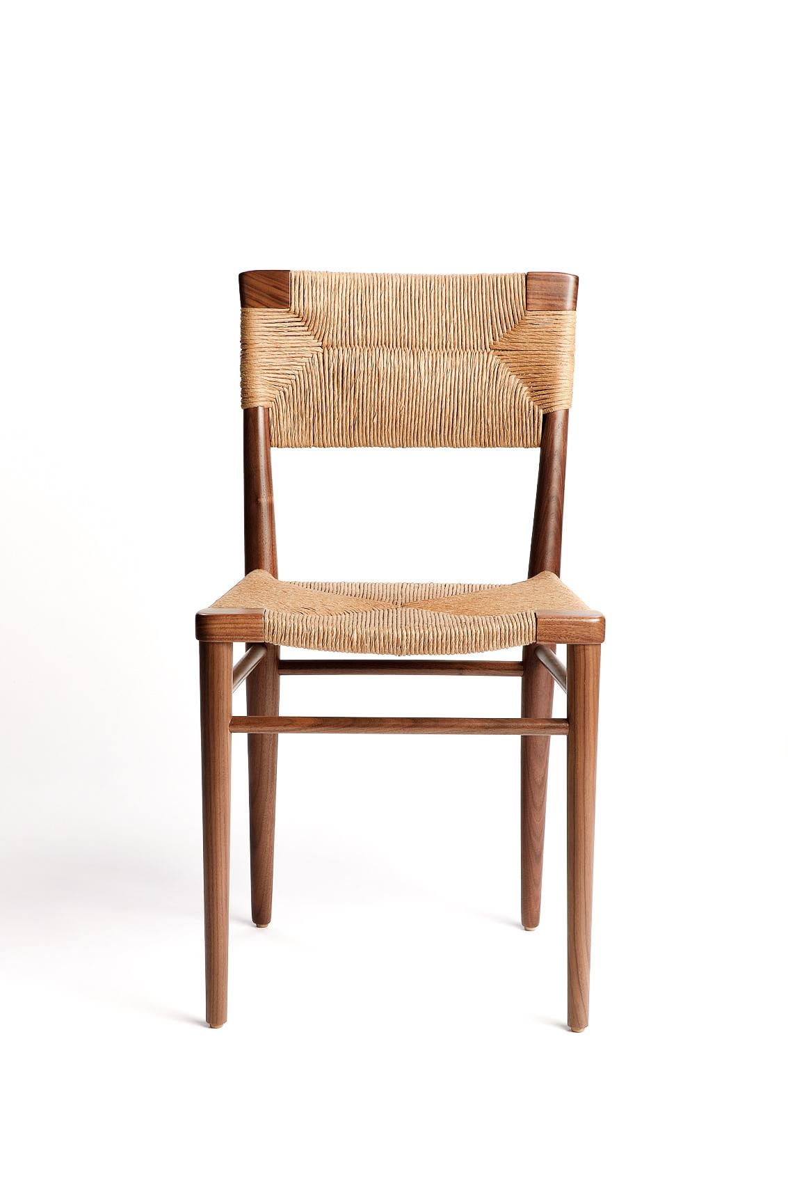 Originally designed by Mel Smilow in 1956 and officially reintroduced by his daughter Judy Smilow in 2018, the woven rush dining side chair is classically midcentury. This collection’s handwoven seating and handcrafted wooden frame provide a