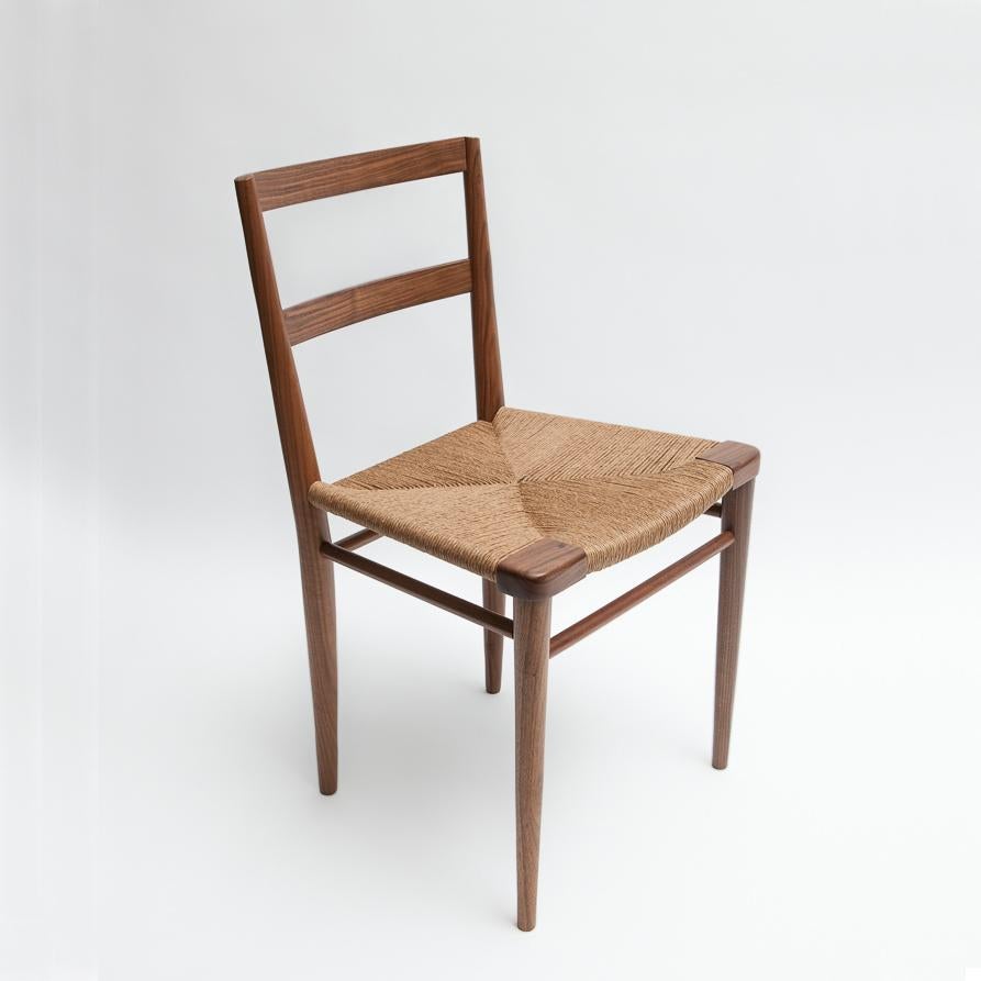 Originally designed by Mel Smilow in 1956 and officially reintroduced by his daughter Judy Smilow in 2013, the woven rush dining side chair is classically midcentury. This collection’s handwoven seating and handcrafted wooden frame provide a