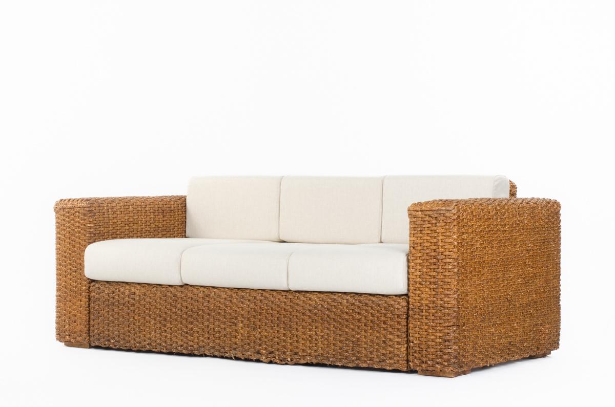 Sofa made in the fifties in France
3-seat
Structure in woven rush
6 cushions in foam covered with beige fabric (new)