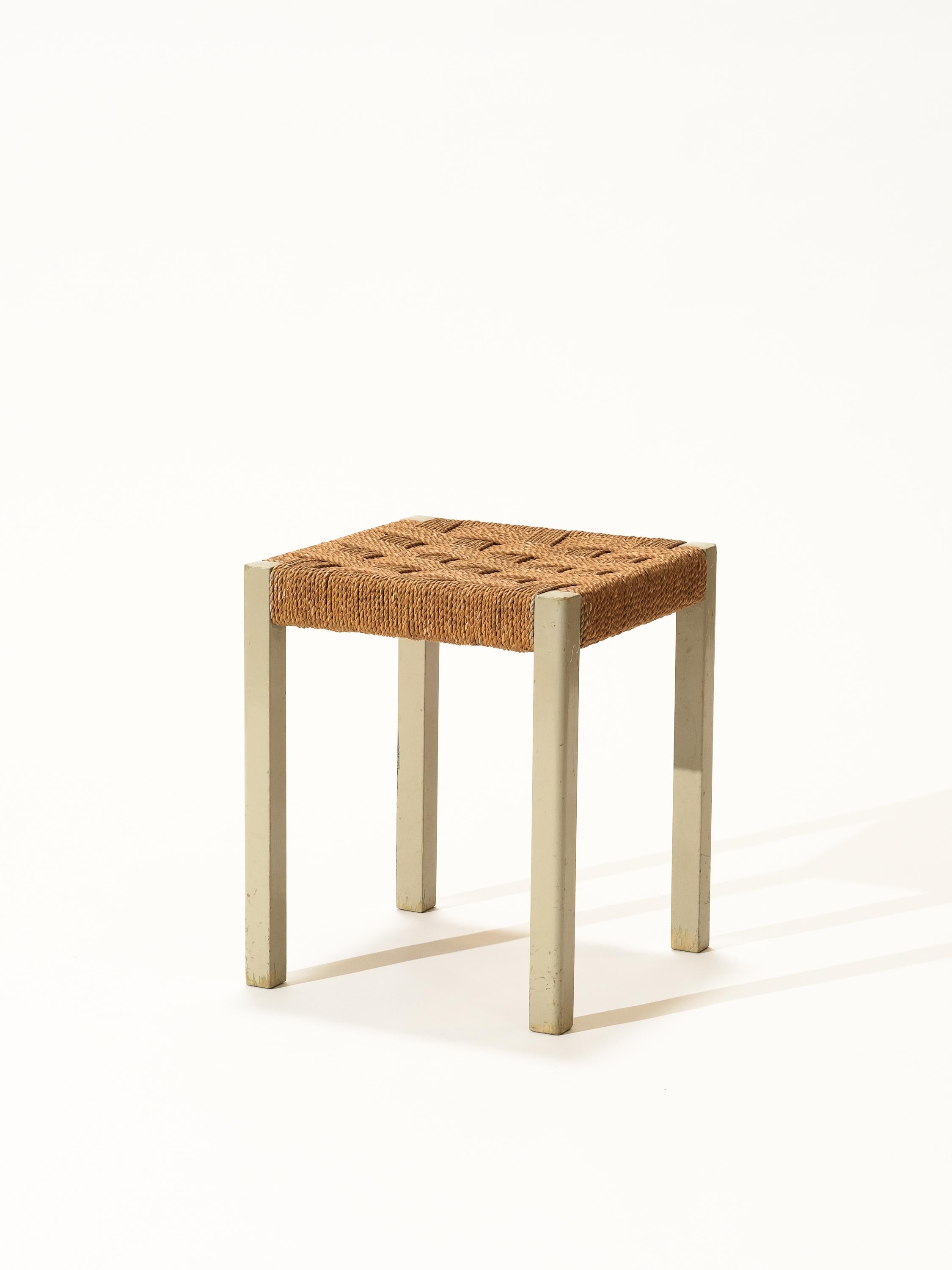 A stool by Axel Larsson. Made of painted wood with woven seagrass seat. All original.
