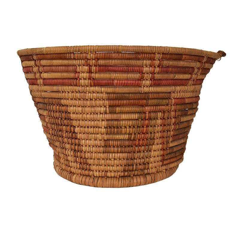 Gorgeous seagrass woven basket. Thought to be wither Native American or African. Beautiful round shape with geometric designs woven into the sides. Would be a great vessel to hold fruit, or for a coffee table to display curiosities.