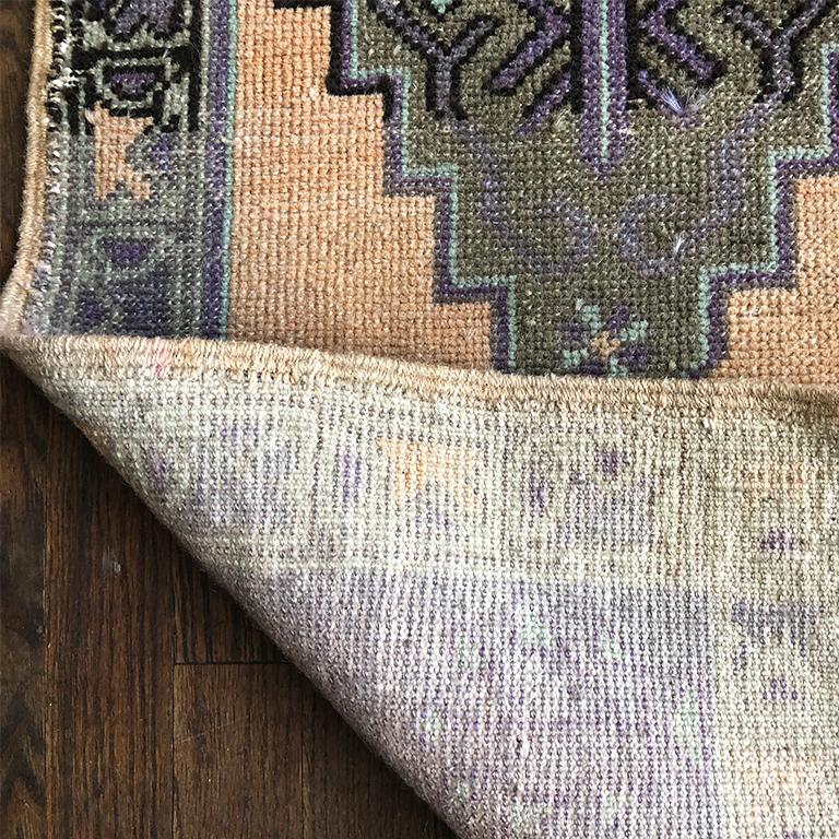 Tribal Hand Woven Turkish Purple, Pastel Pink and Peach Rug with geometric detail For Sale