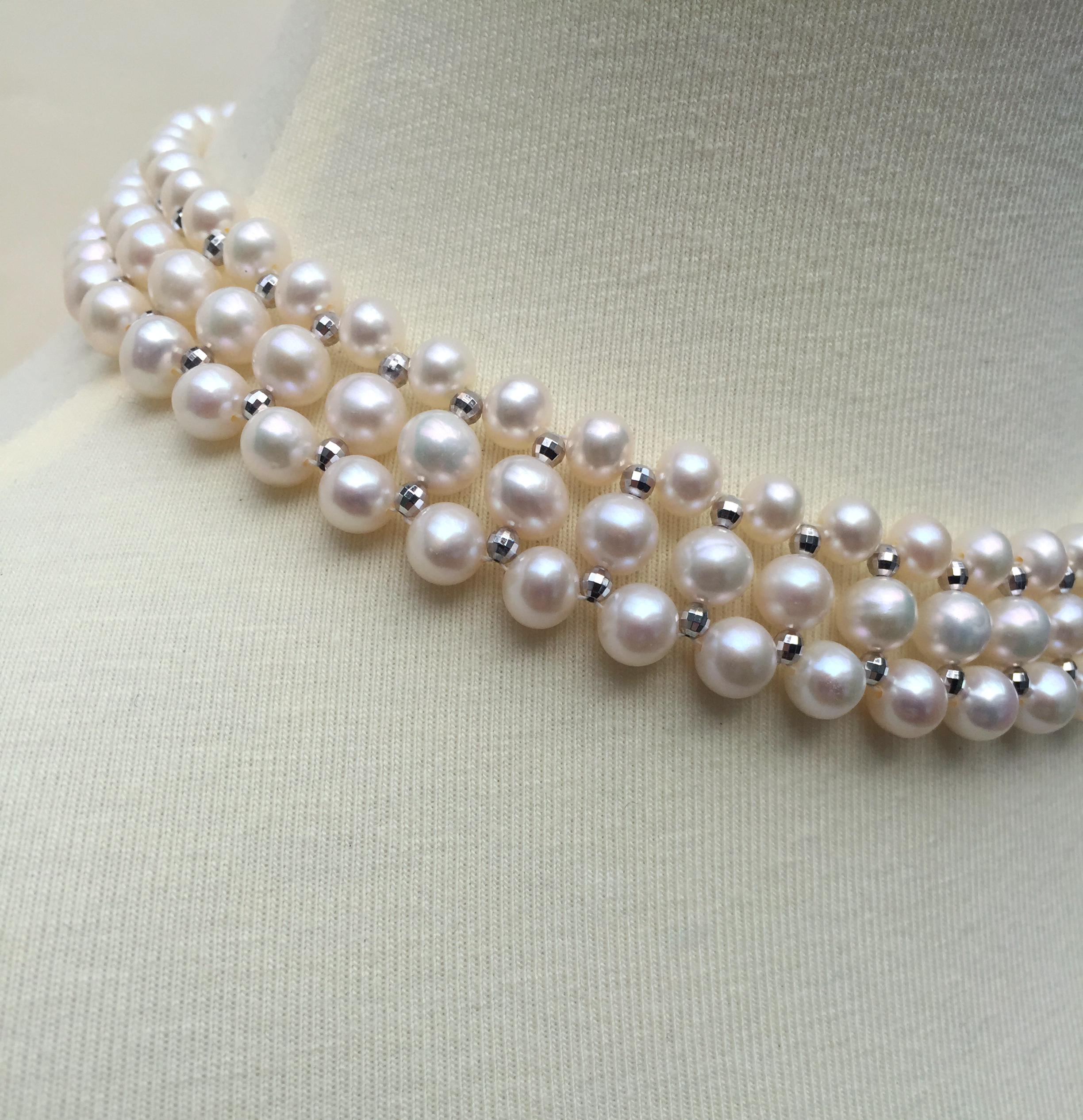This woven white pearl necklace with 14k white gold faceted beads and sliding clasp glitters beautifully. This classic necklace is handmade by Marina J. with 14k white gold faceted beads and glowing white pearls woven together in an elegant design.
