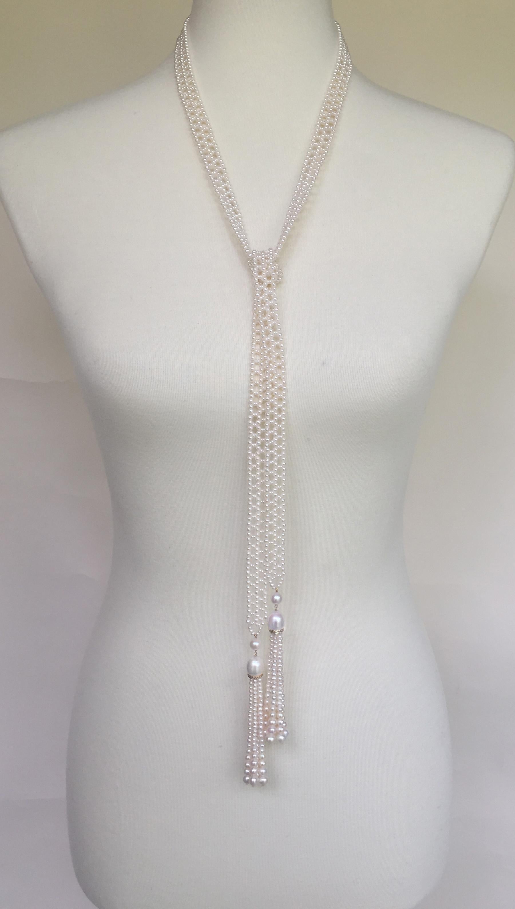 The woven white pearl sautoir necklace with pearl, diamond, and 14k yellow gold tassels has an intricate elegant design. The lace-like design is composed of small white pearls handpicked by Marina J. for their perfect size and shine. The ends of the