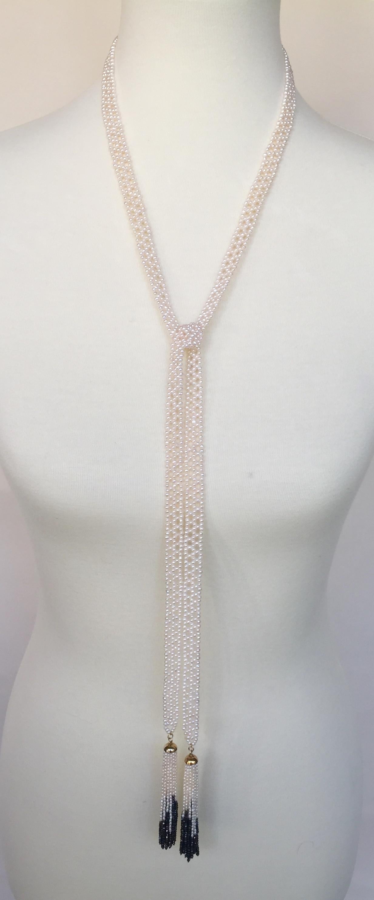 Woven with small white pearls this sautoir is highlighted with 14k yellow gold, white pearl, and faceted black spinel tassels. This Art Deco inspired piece is a beautiful sautoir necklace that has a variety of wearable options from the classic to