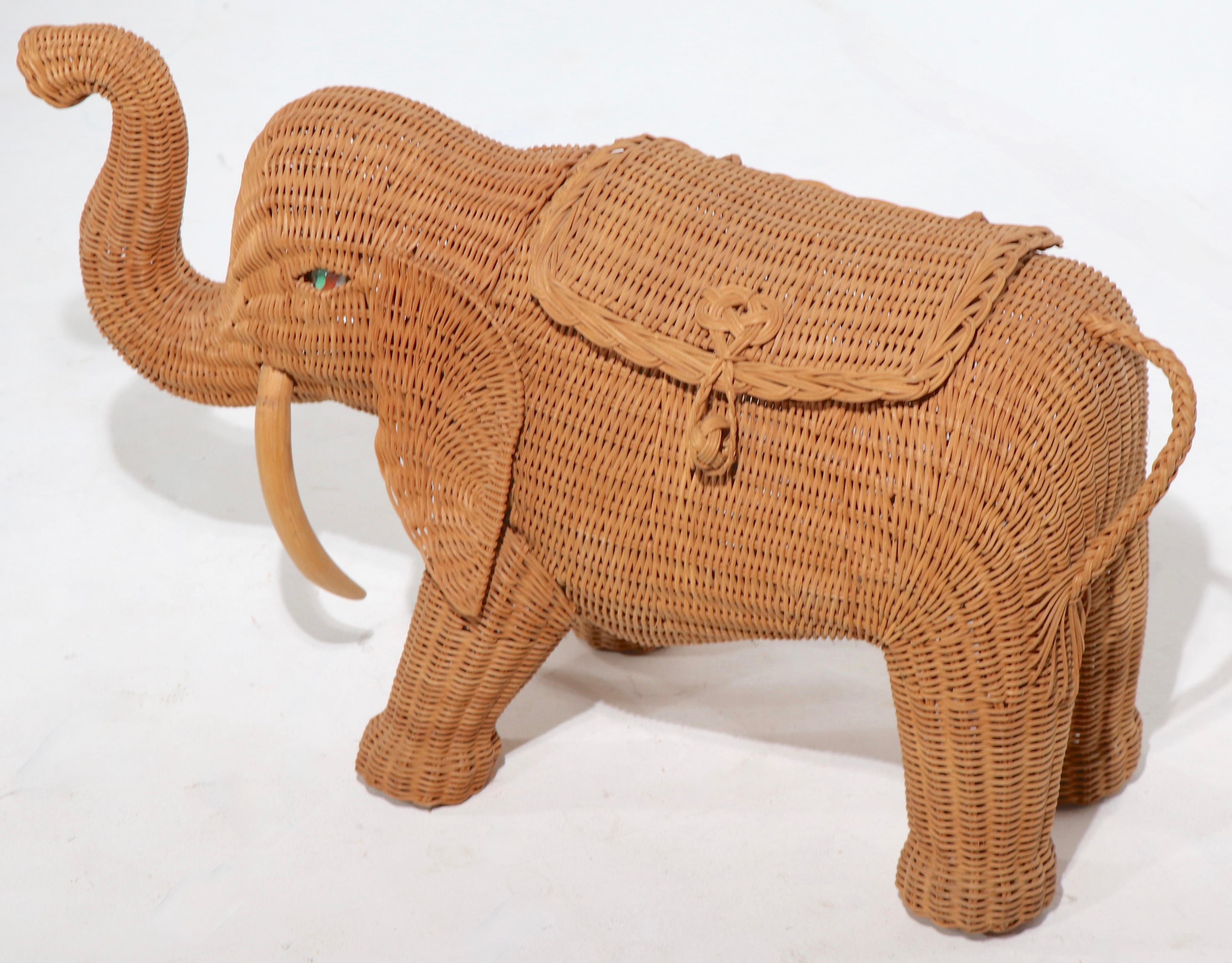 Playful wicker elephant figure with a flip open top. This piece is in very good original condition, one hinge is damaged, please see images.