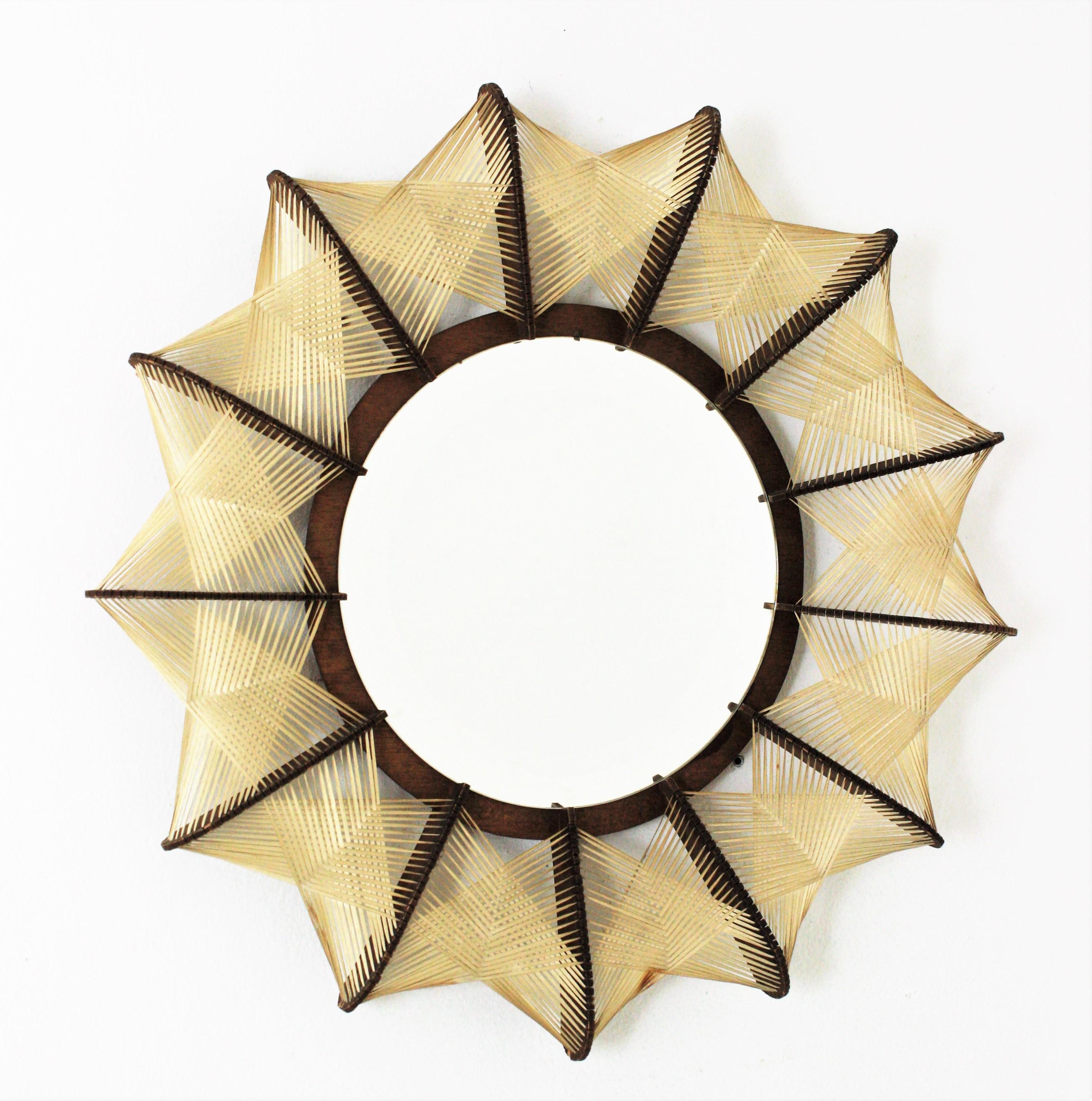 Scandinavian Modern handcrafted wood mirror with braided wicker frame, France, 1960s.
This circular mirror, handcrafted in the Mid-20th century period has Scandinavian design accents. Its sculptural handwoven work at the frame marks the difference.