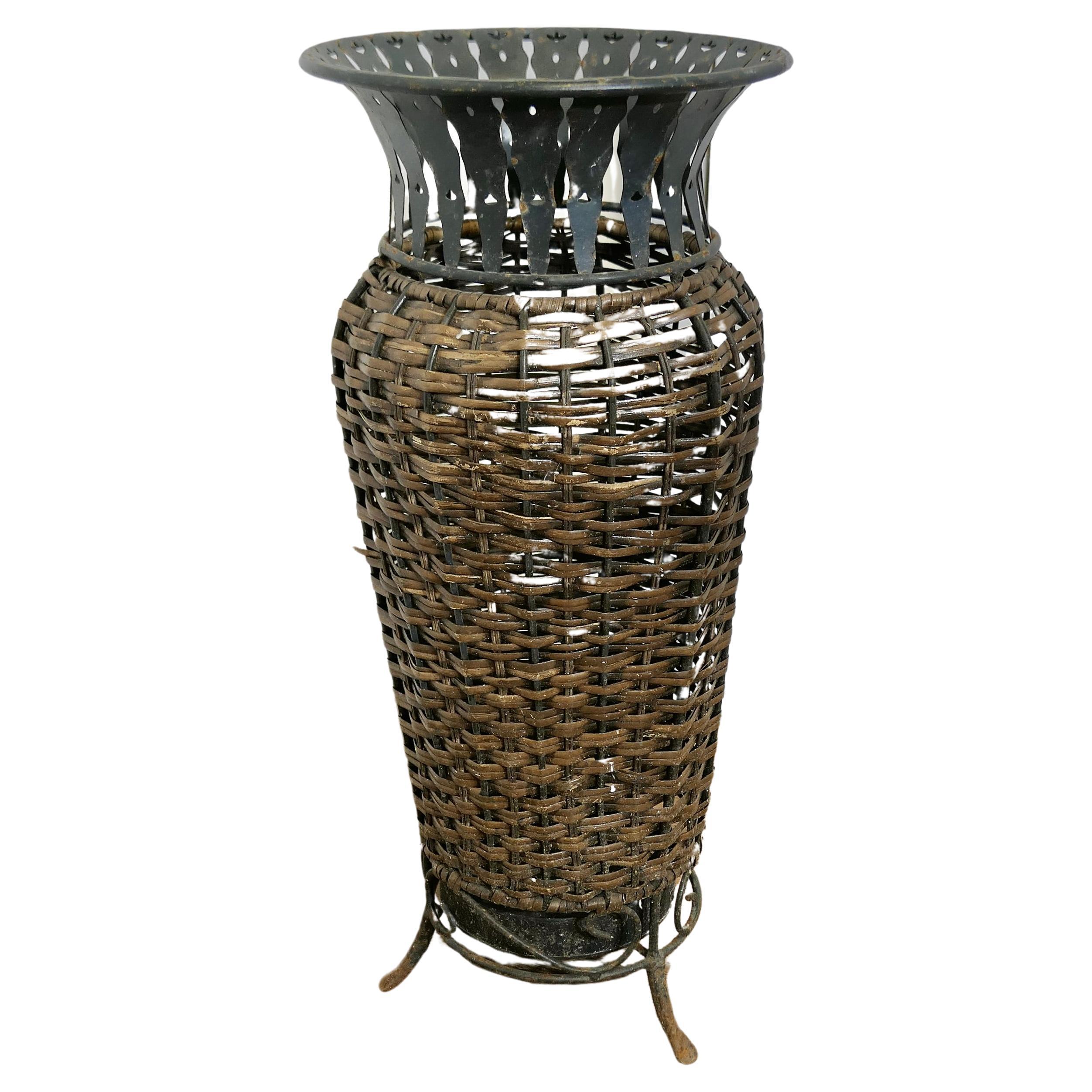 Woven Willow Stick  of Umbrella Stand

A lovely country piece, made from woven willow on a metal frame
An unusual piece in good used condition, 24” Tall and 10” in Diameter
FB279
