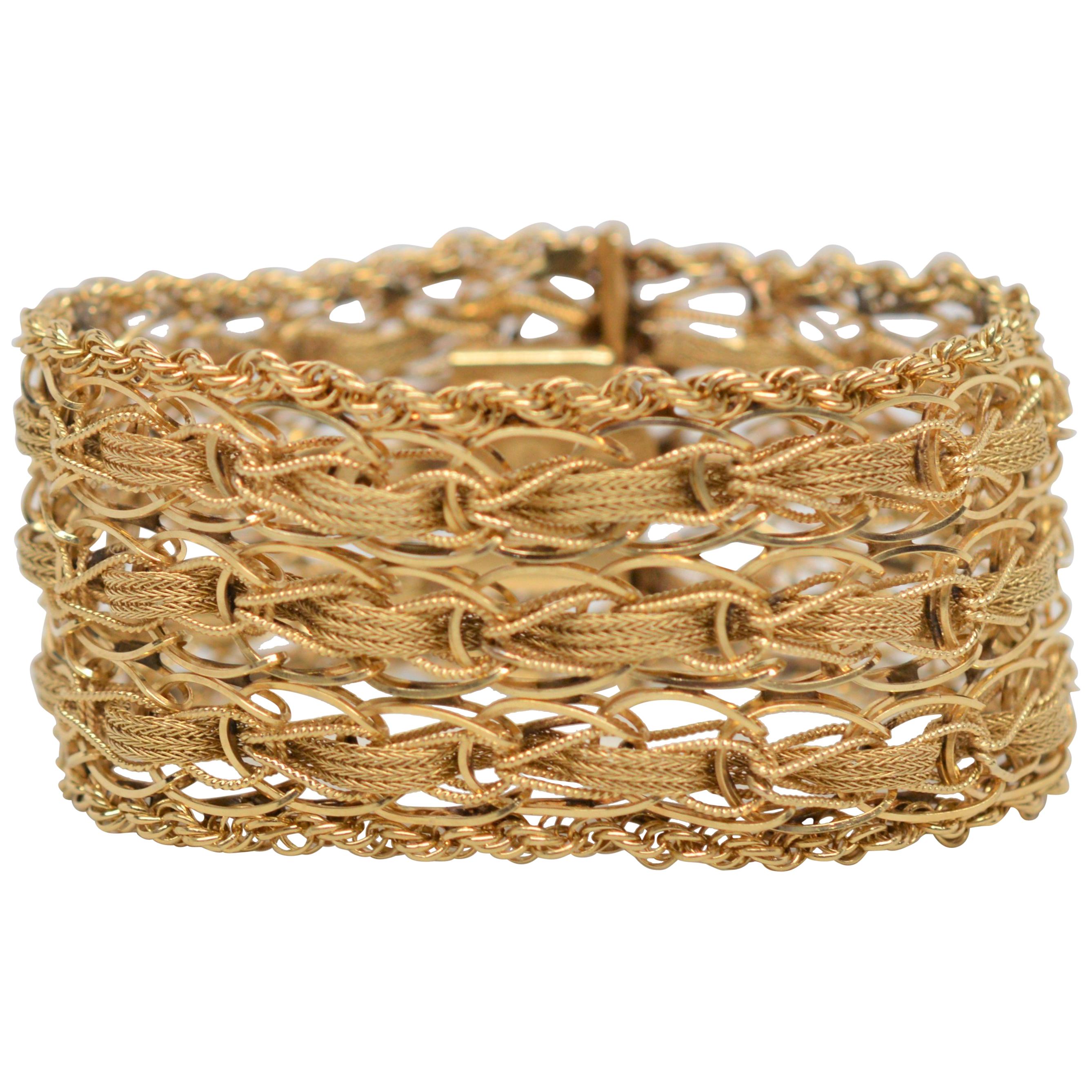 Breites Armband aus 14 Karat Gelbgold mit gewebtem Seil