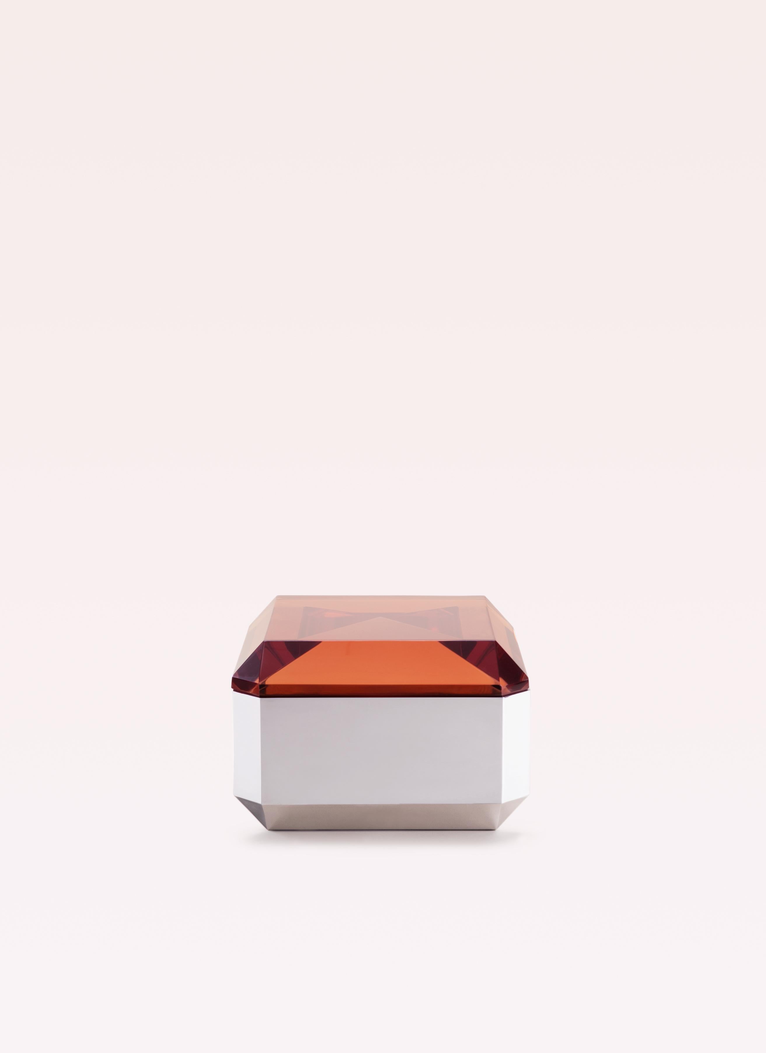 Inspired by the geometry of a diamond, the WOW small table fuses sharp precision with a pop-glamour spirit. Its glossy crystal-resin top, cast in a custom mold with a pyramid-like inner cavity, amplifies light refraction to create a kaleidoscopic