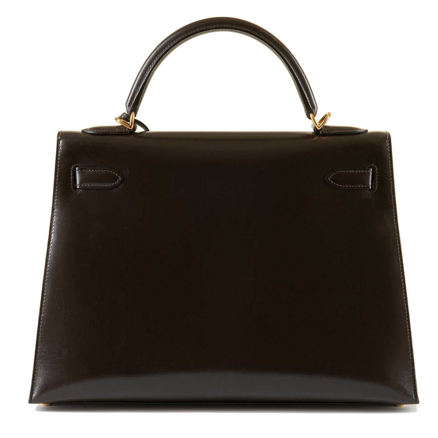 A simply stunning Hermes 32cm Kelly Sellier Bag. In superb condition throughout, the bag is finished in Chocolate Brown Box Calfskin, beautifully accented with gold hardware. From a private collection in Paris, the bag has been very lightly used,