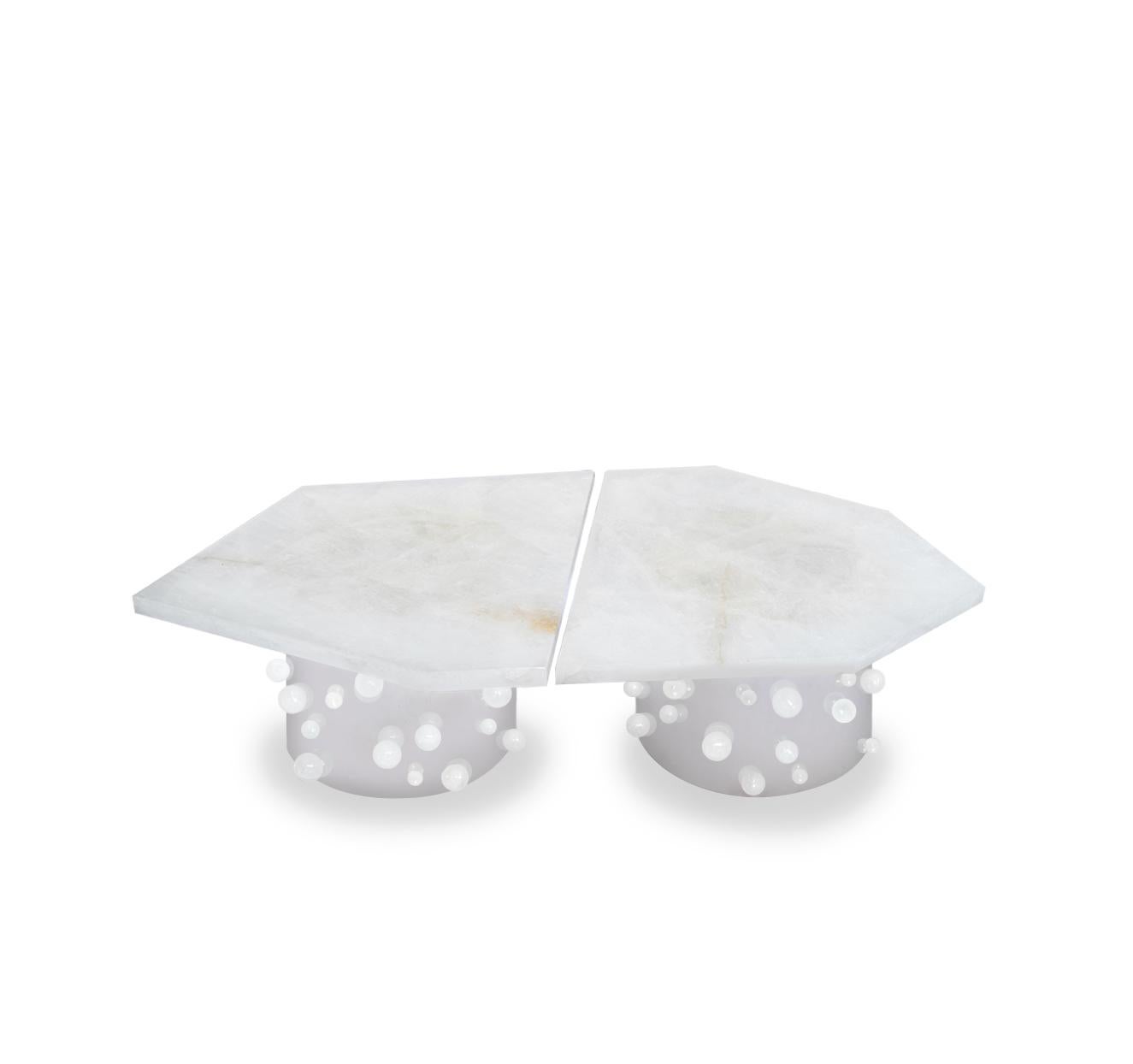 A large polygonal form cocktail table by two rock crystal tops and two rounded polish nickel bases with rock crystal bubbles decoration. Created by Phoenix Gallery, NYC. 
Custom size and finish upon request.