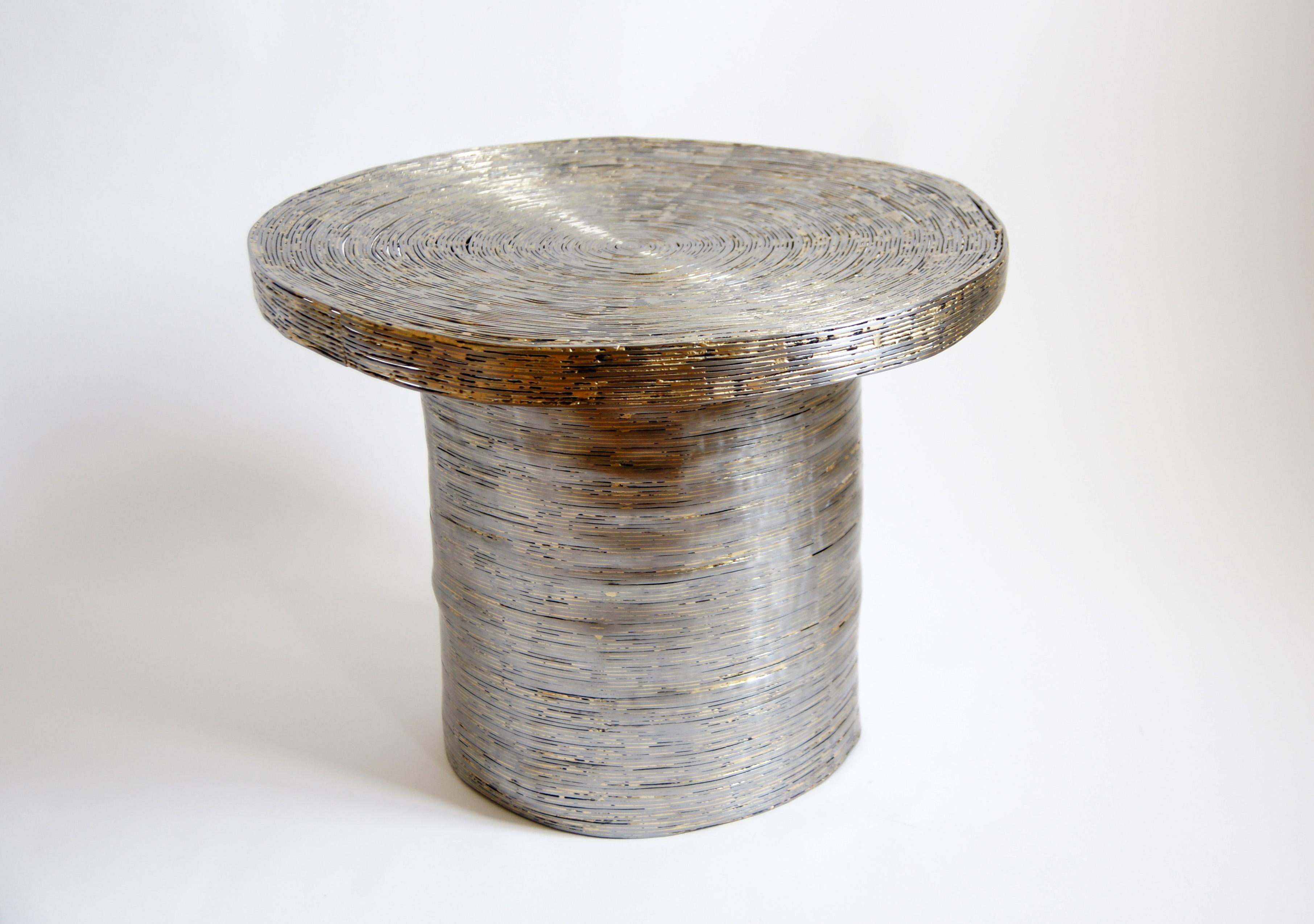 Wrap side table by Johannes Hemann
Material: Steel.
Dimensions: Ø 60 x H 55 cm.

All our lamps can be wired according to each country. If sold to the USA it will be wired for the USA for instance.

Wrap examines the shells of things remaining