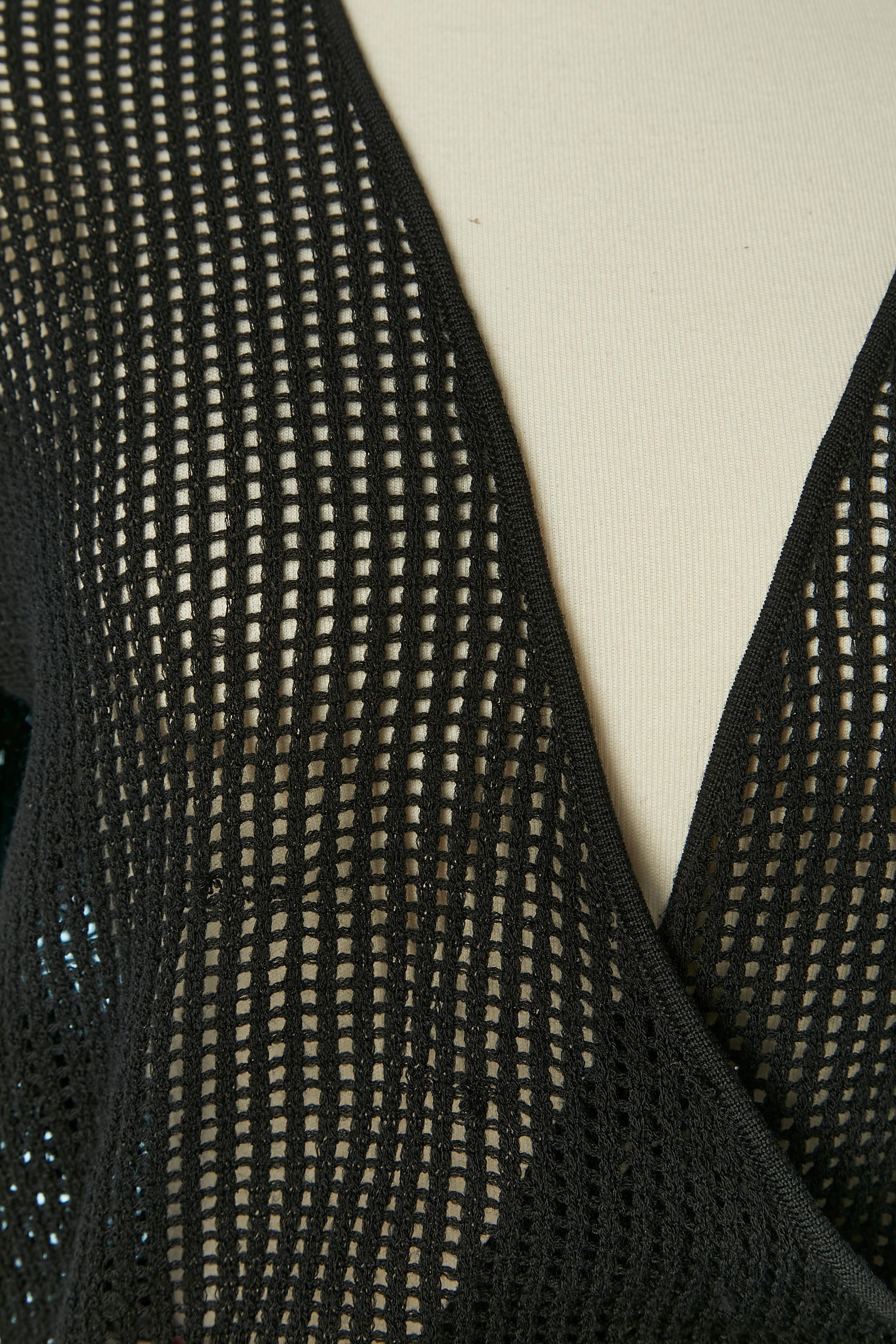 Wrap top and printed skirt ensemble. The top is made of black knit and silk printed chiffon.
SIZE 44 (Fr) L 