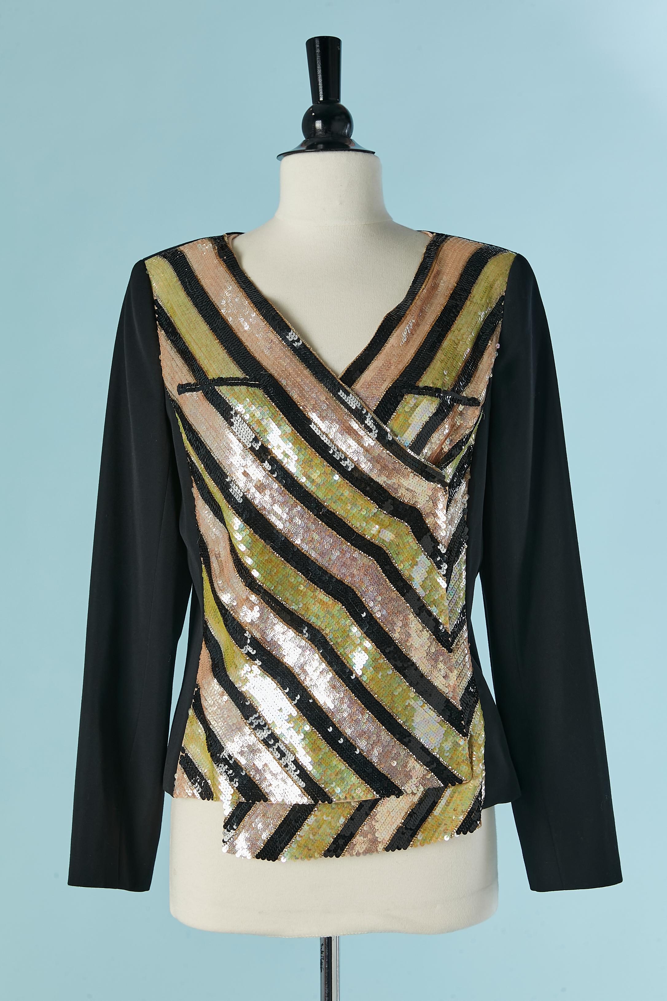 Wrap wool and sequin asymmetrical jacket with striped pattern and snap closure. The back and the sleeve are in wool. Silk lining. Chain inside on the bottom edge . Shoulder pad. size 40 (Fr) L 
