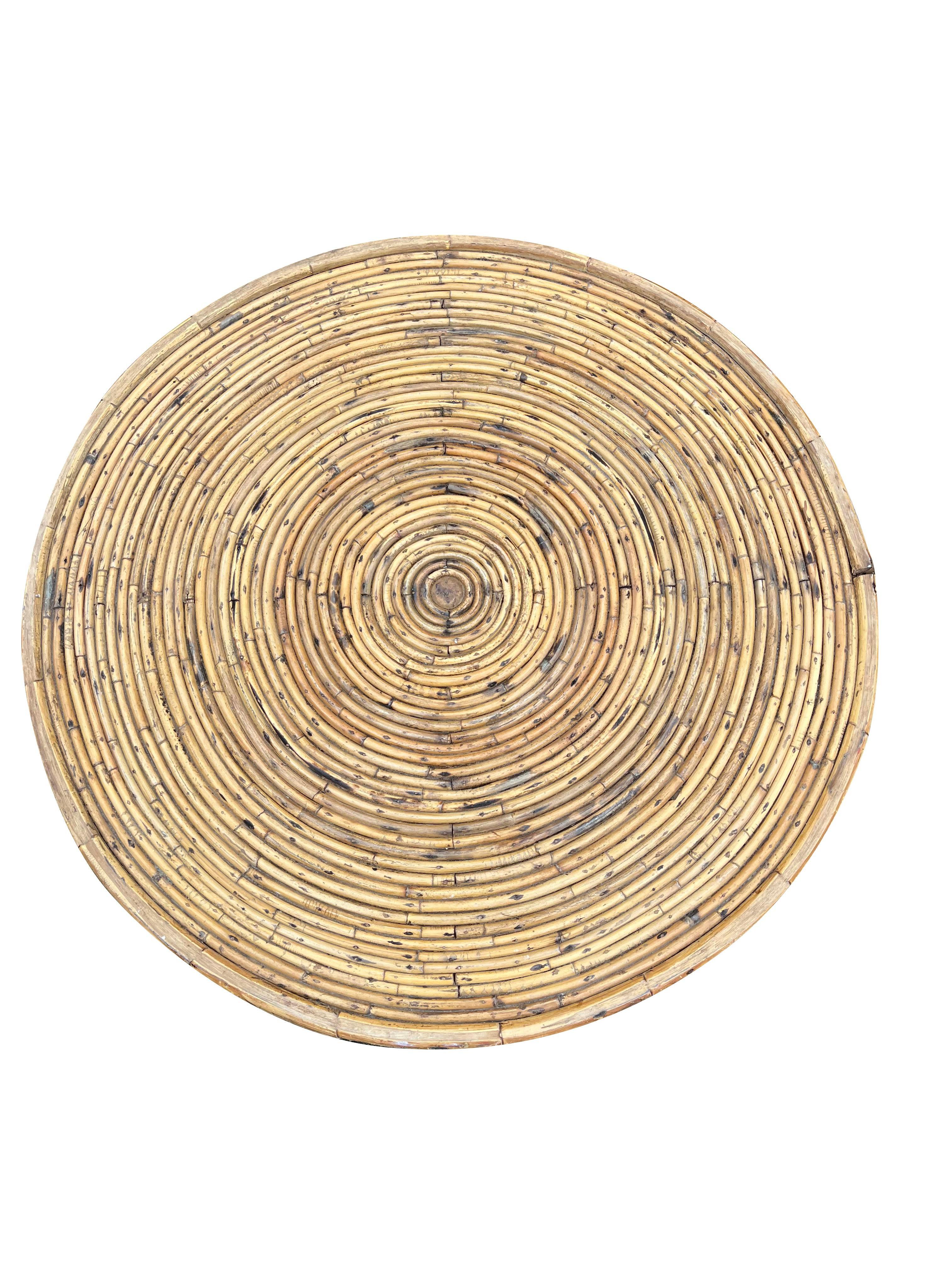 Vintage Wrapped Rattan Wicker Round Coffee Table.

Add a touch of coastal bohemian chic to your home with this stunning vintage rattan wrapped coffee table. This beautifully crafted piece features a unique rattan design and a natural, organic
