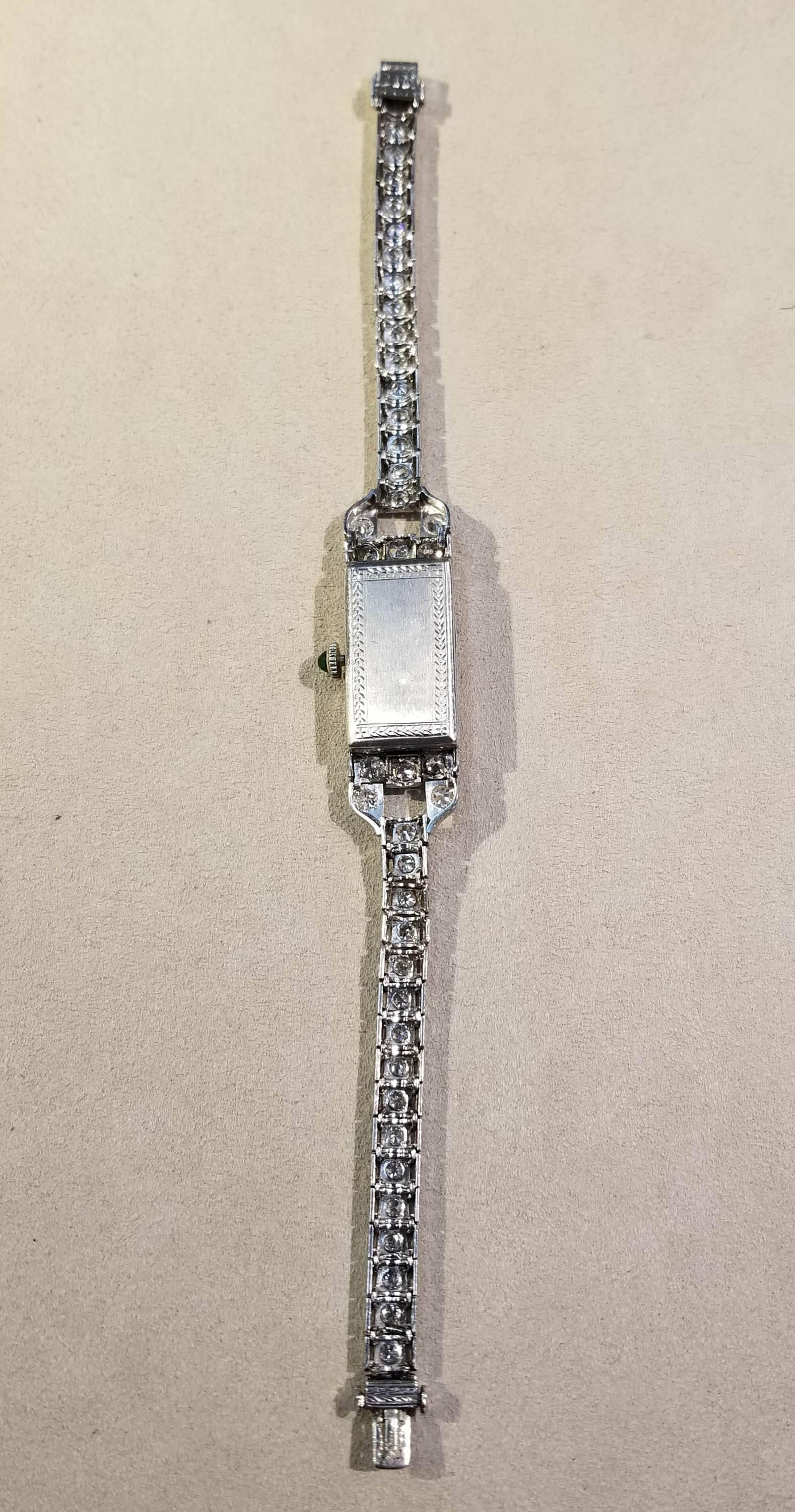 Old European Cut Wristwatch, Platinum, Diamond and Emerald, Art Deco, circa 1920s For Sale