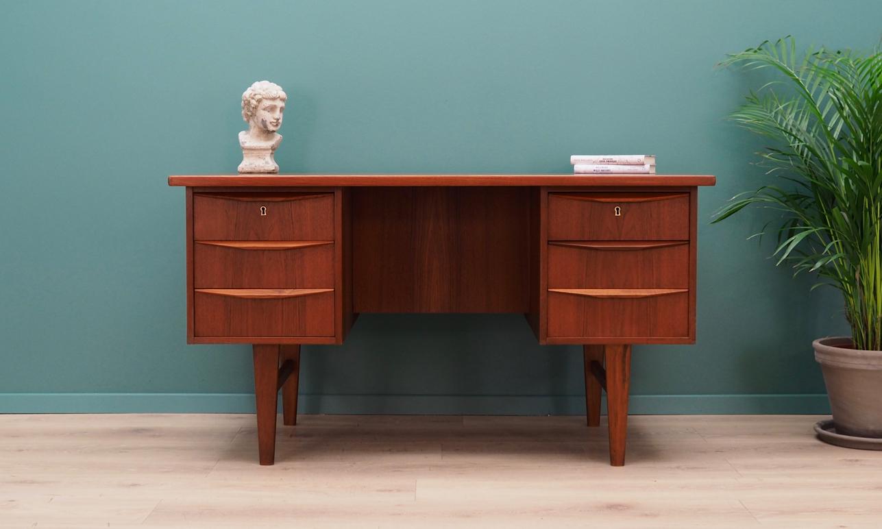 Fantastic writing desk from the 1960s-1970s. Scandinavian design, Minimalist form. The surface of the furniture finished with teak veneer. Desk has six drawers, no key included. Maintained in good condition (minor bruises and scratches) - directly