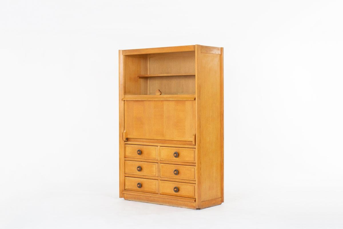 Cabinet designed by Robert Guillerme and Jacques Chambron in the 60s
Edited by Votre Maison
Entirely made of oak
Nice patina of the time
Ceramic handles by Boleslow Danikowski
Patinated leather strap