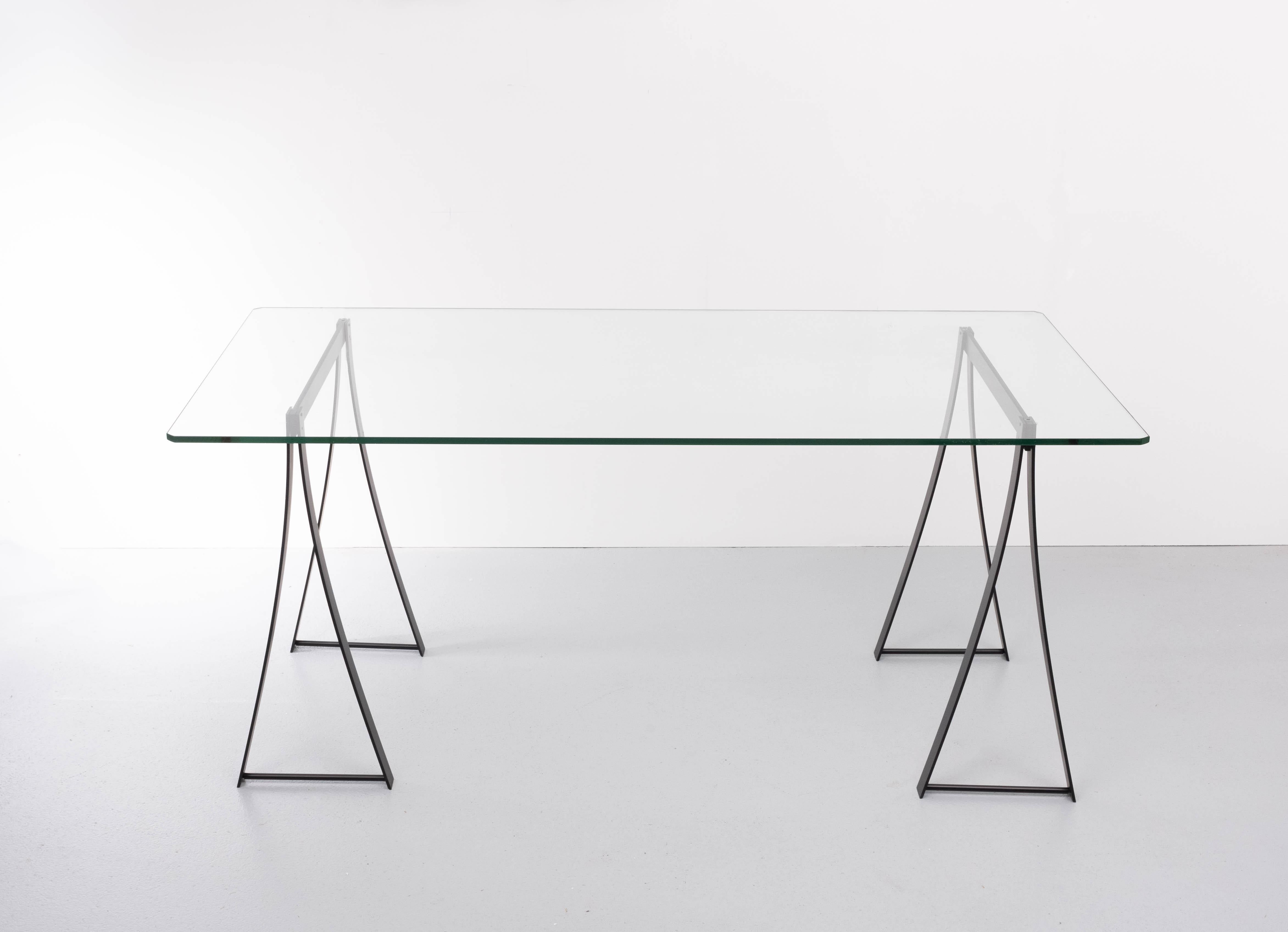 Very nice writing desk. The thick Cut Glass top rests on Stainless steel trestles. Design by Peter Ghyczy for Ghyczy
Model T07. 1970s glass plate (so-called float glass), 12 mm thick. Good condition. The stainless steel trestles are resprayed in a