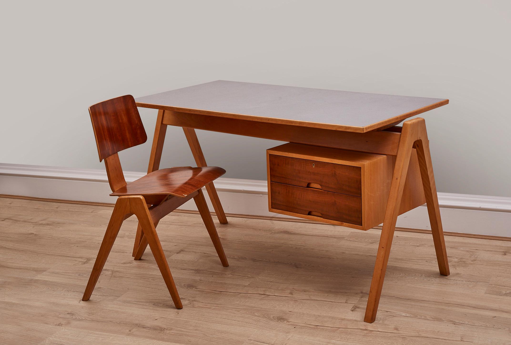 1950s Writing desk, made for Hille, Beechwood, extremely good vintage condition
 
About the designer: 
Robin Day was an iconic British industrial designer, best known for his injection-moulded polypropylene stacking chairs – more than 20 million of