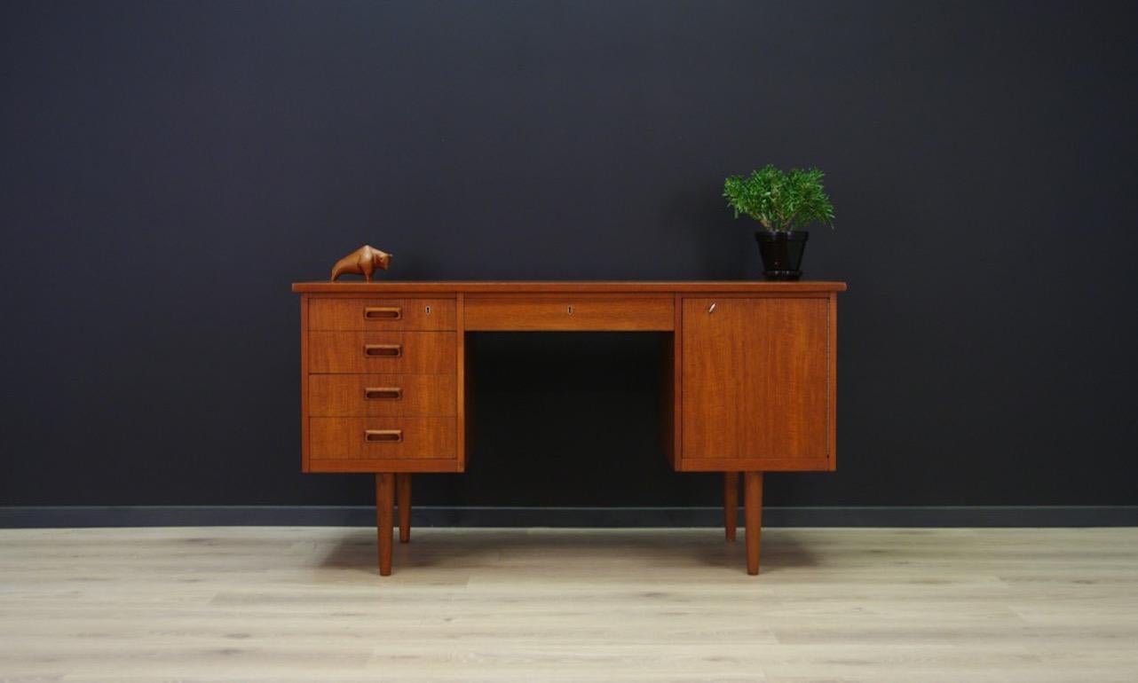 Minimalist desk from the 1960s-1970s, classic form, Danish design. Finished with teak veneer, has five practical drawers and a spacious cabinet. The set also includes a key. Preserved in good condition (minor scratches and dings, filled veneer loss)